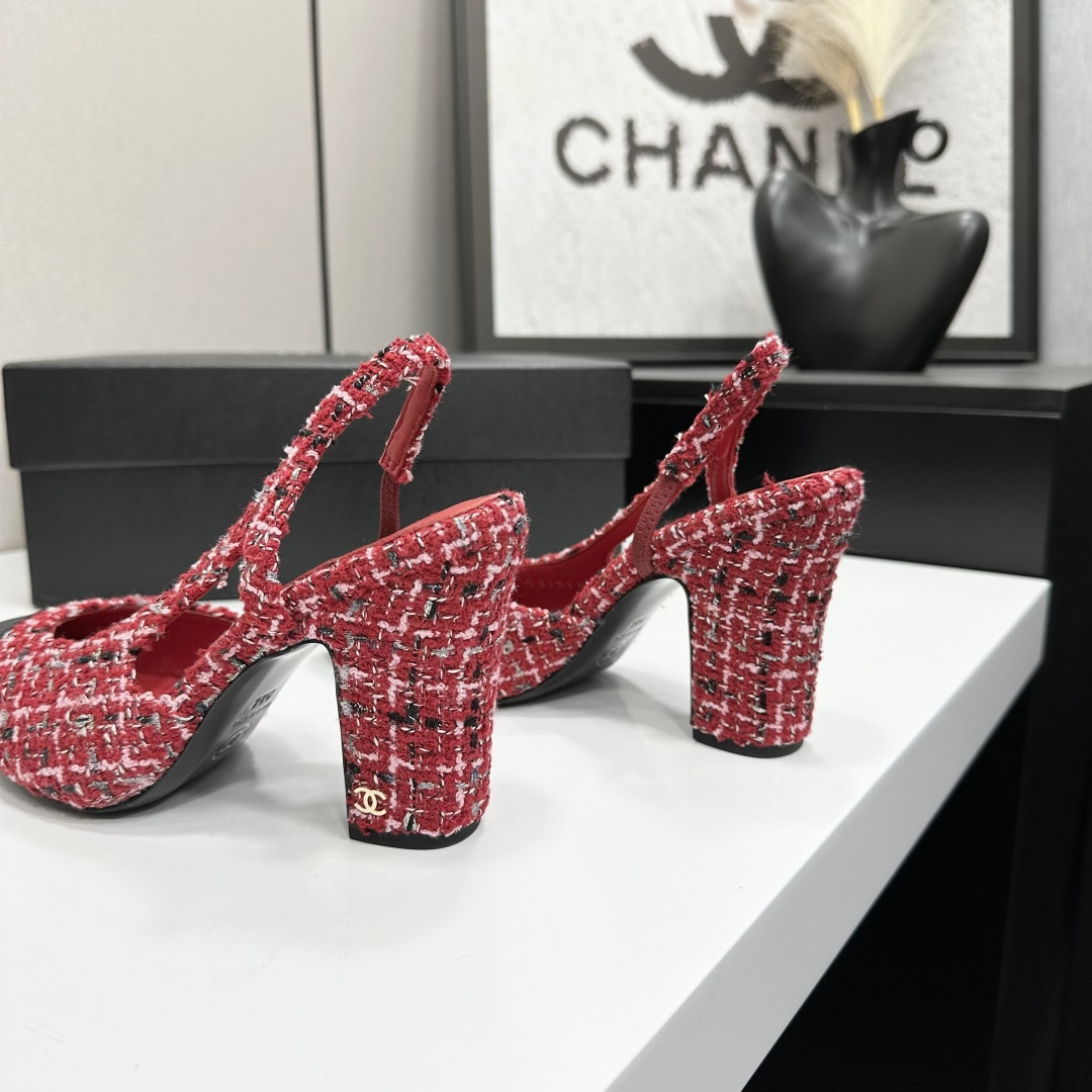 A pair of luxury Chanel red and white tweed slingback heels with black cap toes and chunky block heels displayed on a black branded box. - Hình 9