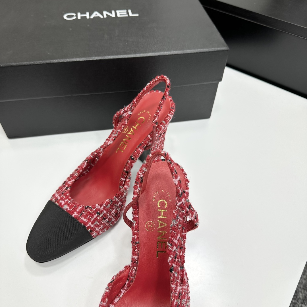 A pair of luxury Chanel red and white tweed slingback heels with black cap toes and chunky block heels displayed on a black branded box. - Hình 8