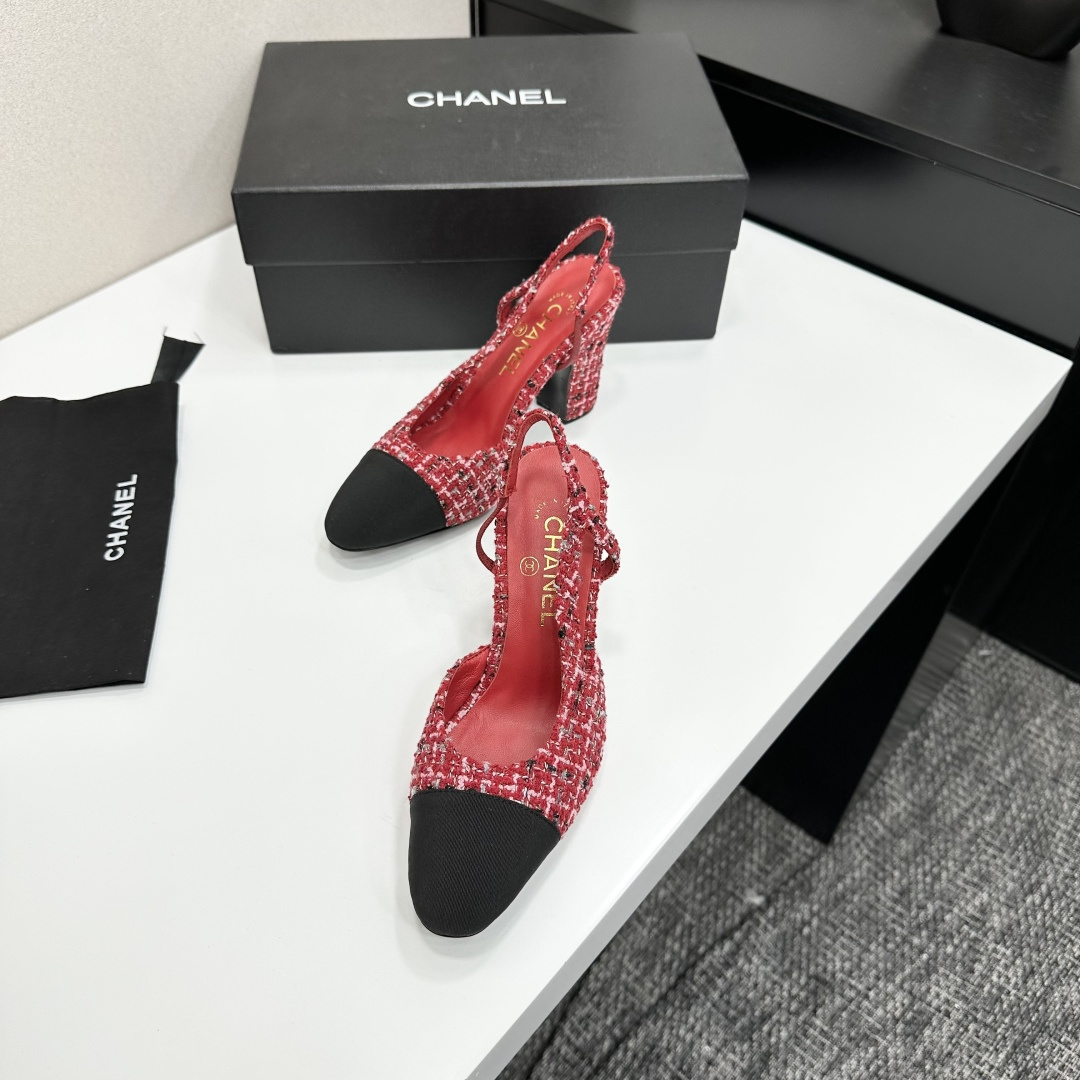 A pair of luxury Chanel red and white tweed slingback heels with black cap toes and chunky block heels displayed on a black branded box. - Hình 6