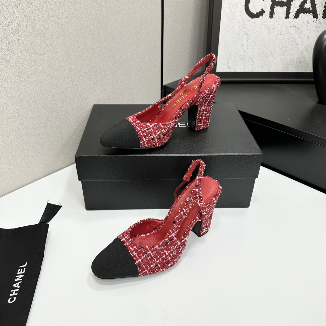 A pair of luxury Chanel red and white tweed slingback heels with black cap toes and chunky block heels displayed on a black branded box. - Hình 3