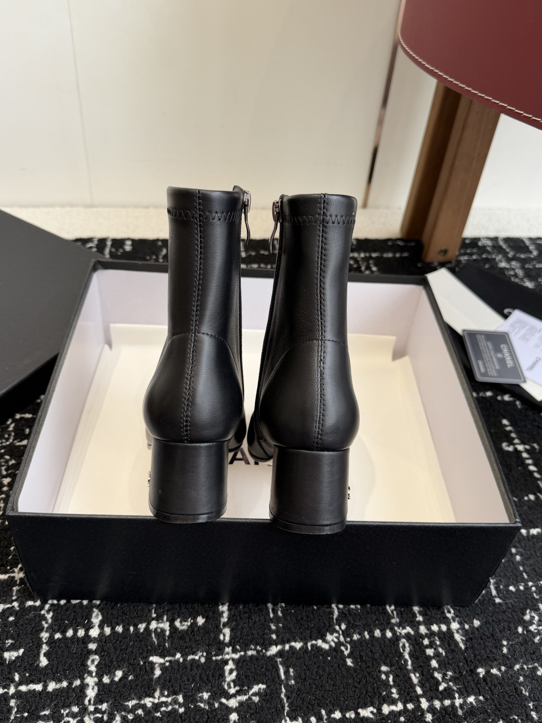 Pair of Chanel black leather ankle boots with cap toe and gold CC logo on block heel. - Hình 8