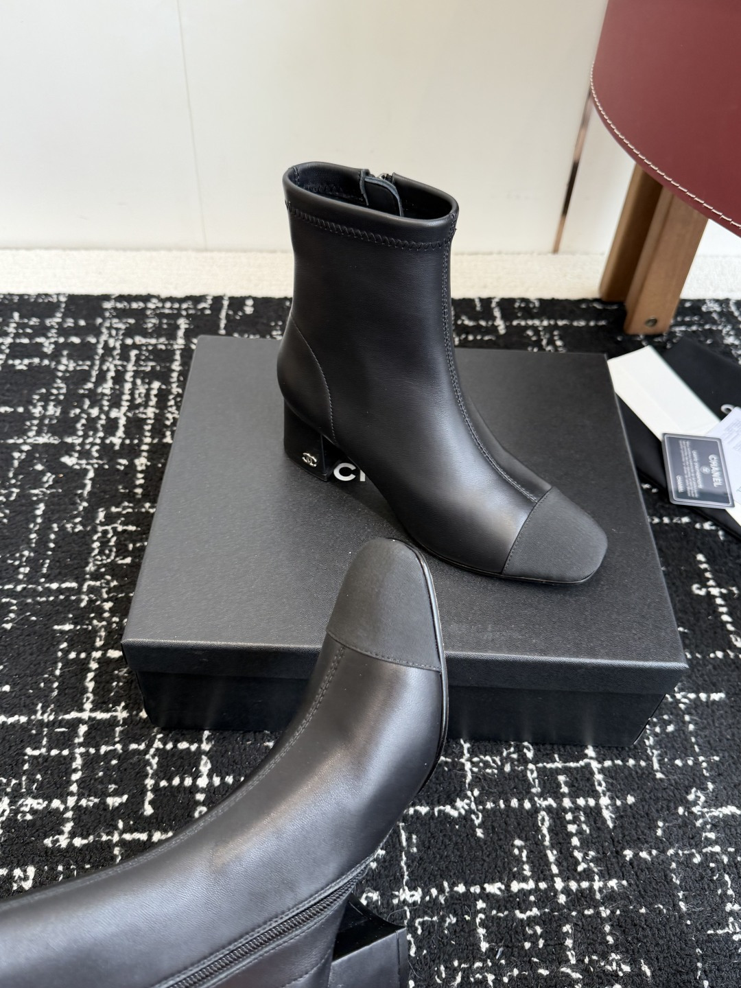 Pair of Chanel black leather ankle boots with cap toe and gold CC logo on block heel. - Hình 7