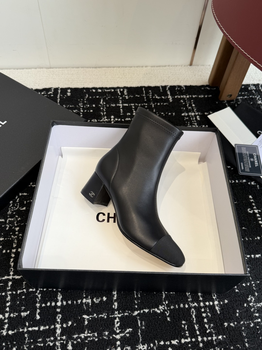 Pair of Chanel black leather ankle boots with cap toe and gold CC logo on block heel. - Hình 6