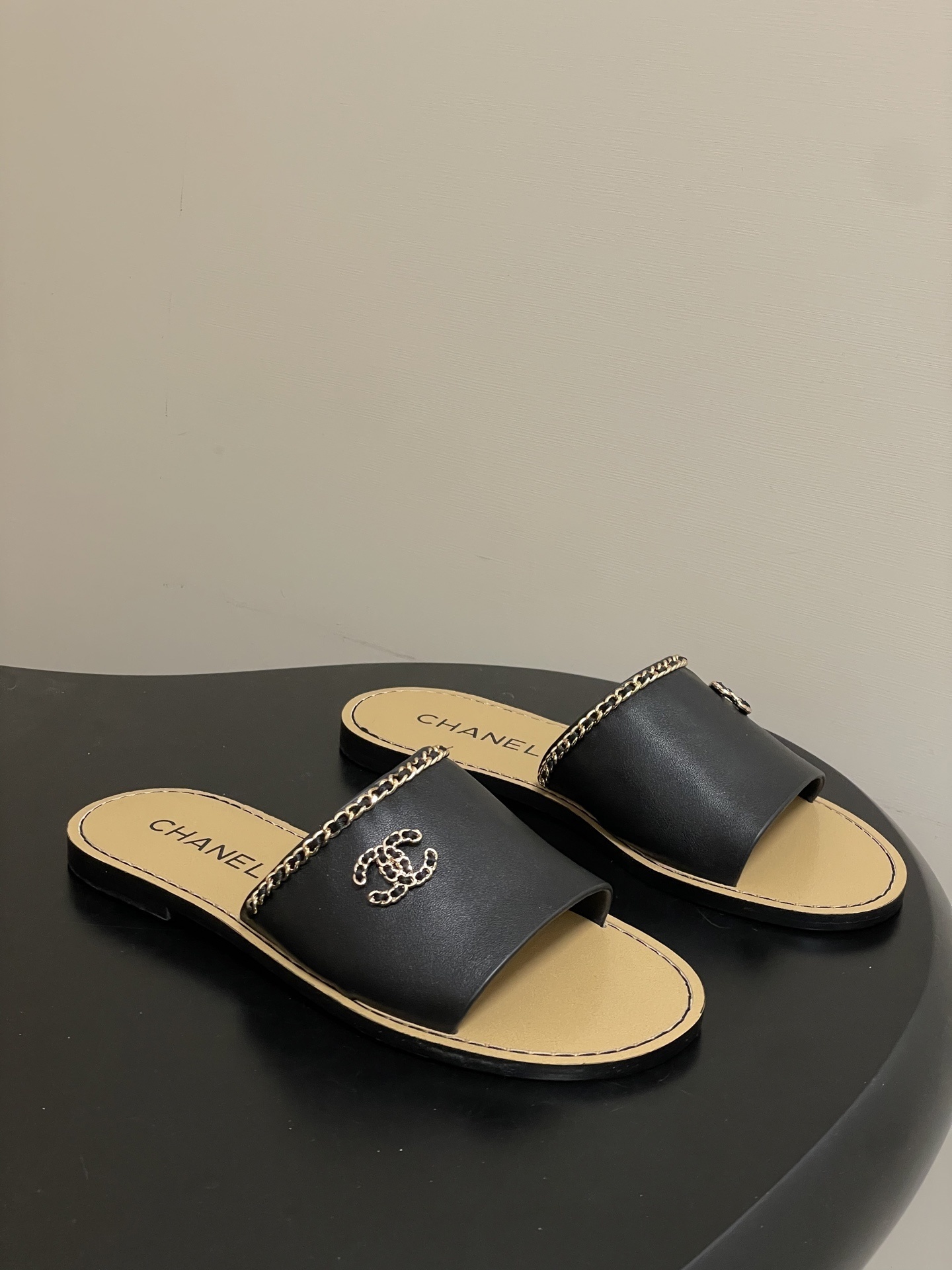 Chanel Luxury Black Leather Flat Slides with Gold Chain Detail