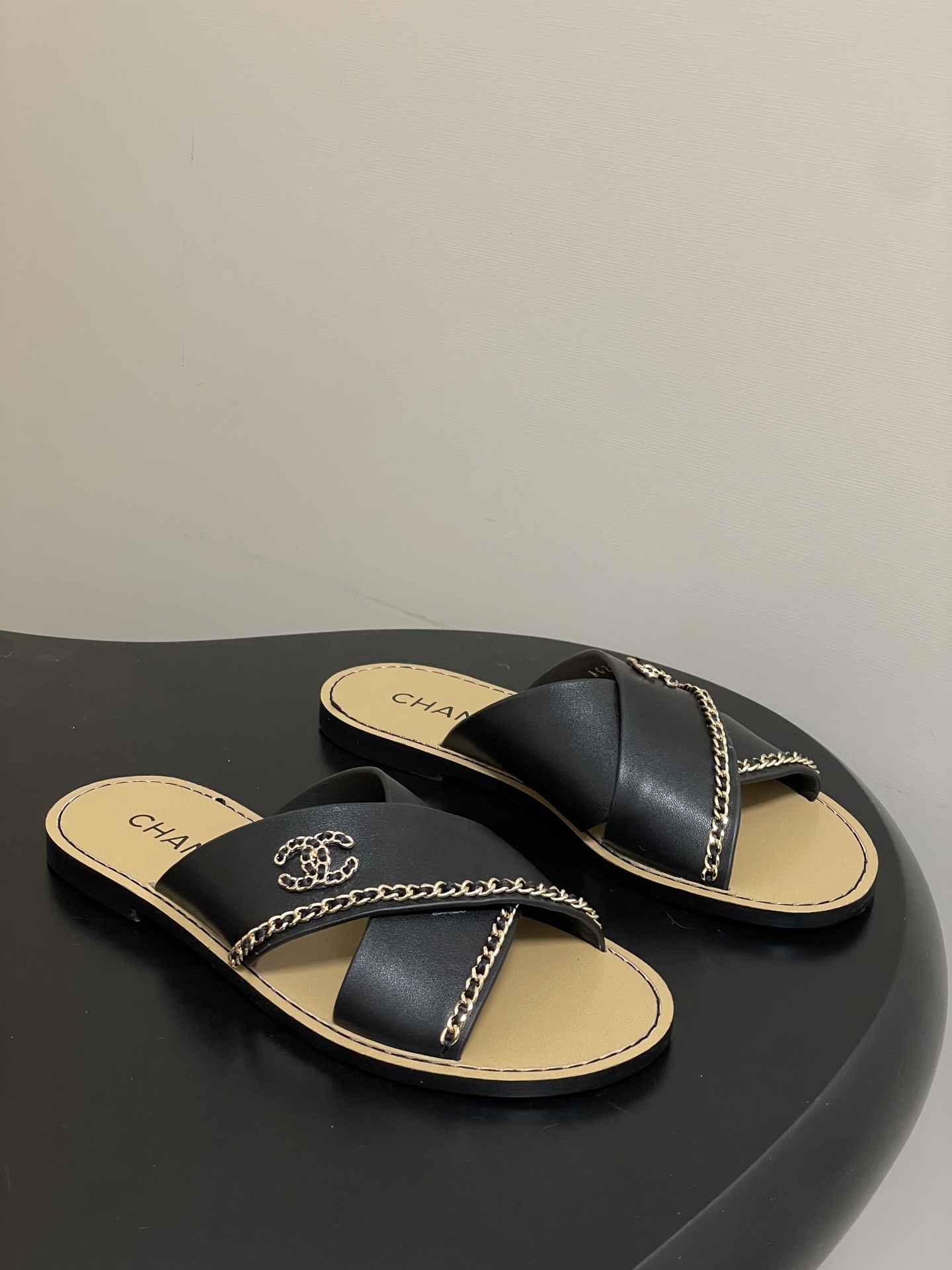 Luxury Chanel Black Leather Crossover Sandals – Gold Chain CC Logo