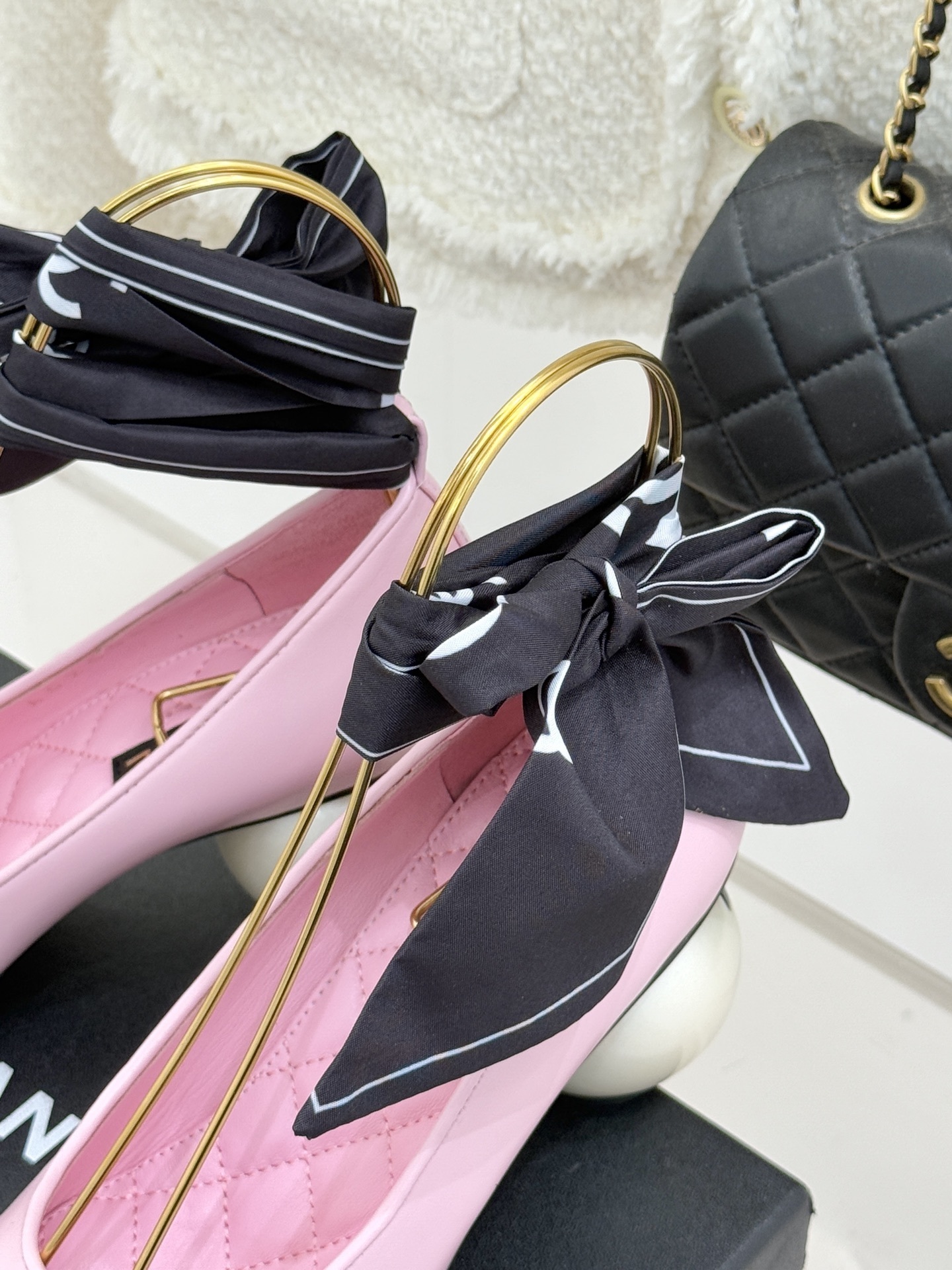 Luxury Chanel pink leather pumps with black cap toe, unique white pearl heel, and black silk scarf bow detail. - Hình 8