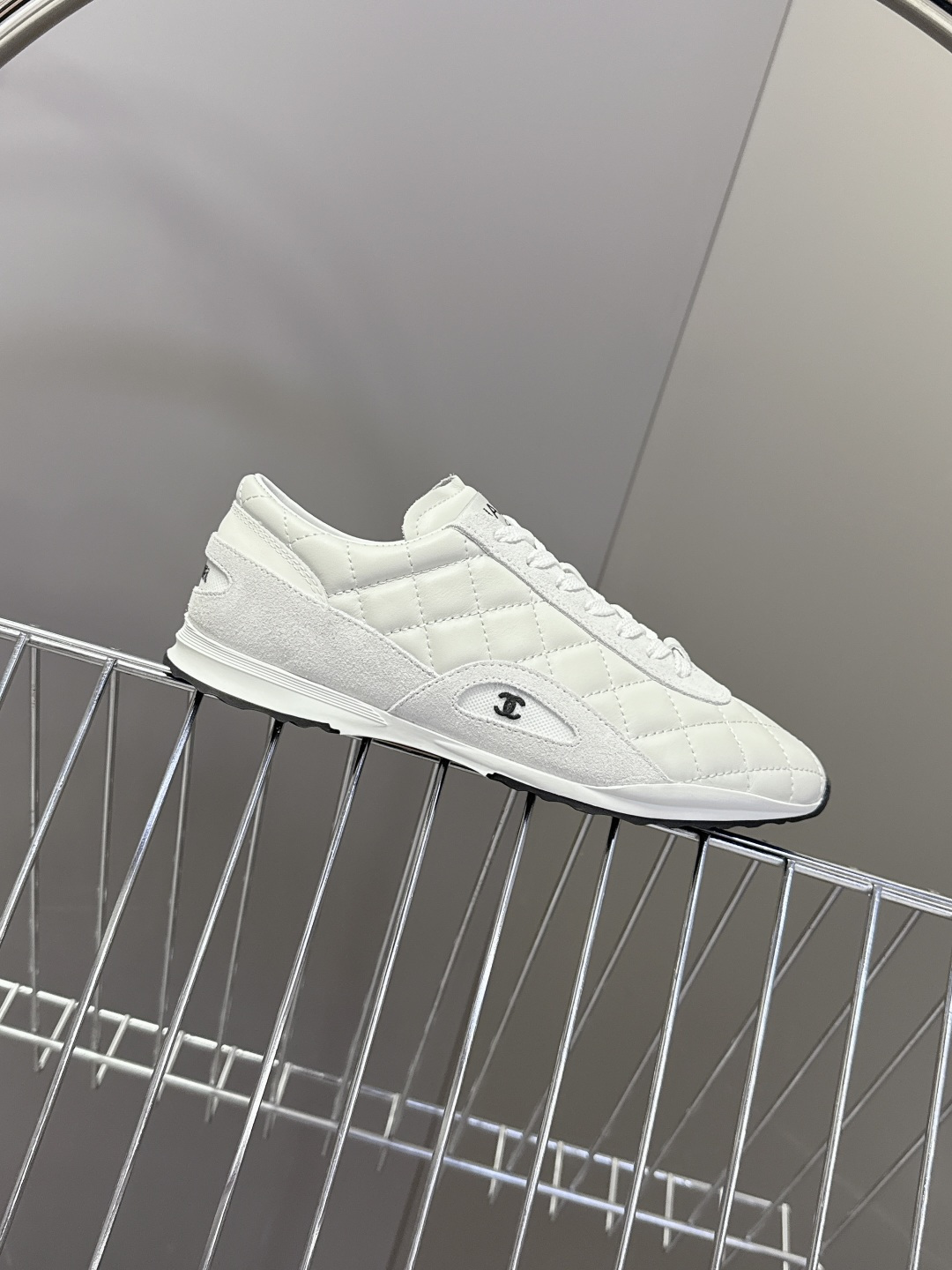 A pair of luxury white Chanel quilted leather sneakers with suede accents next to an original Chanel box. - Hình 5