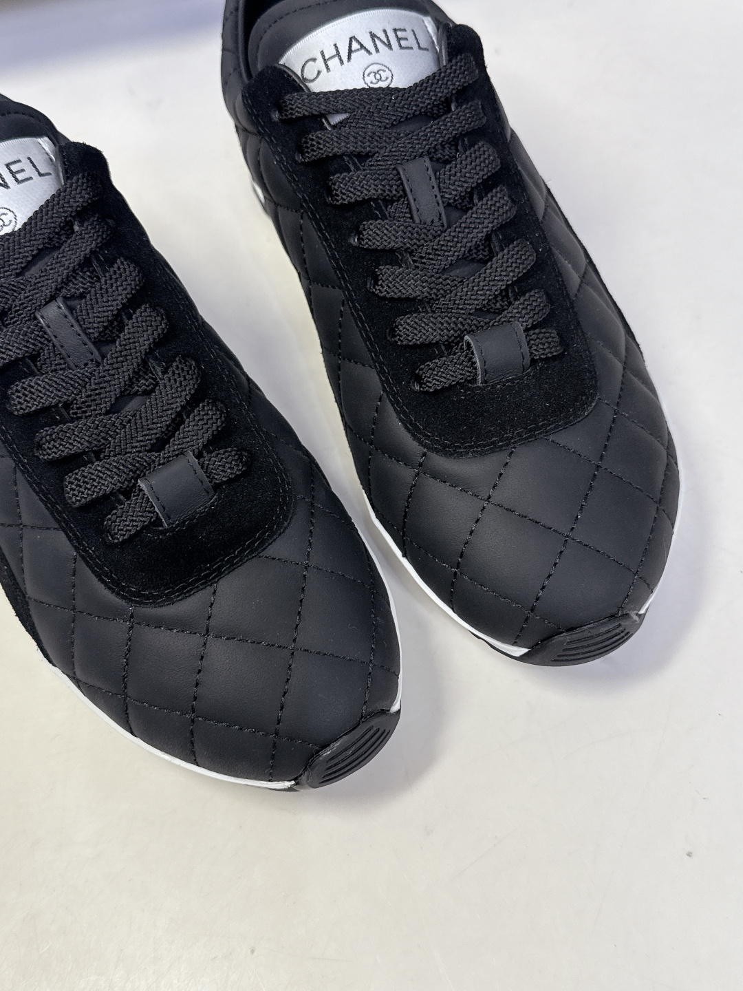 Pair of black Chanel quilted sneakers with white CC logo and original designer box - Hình 7