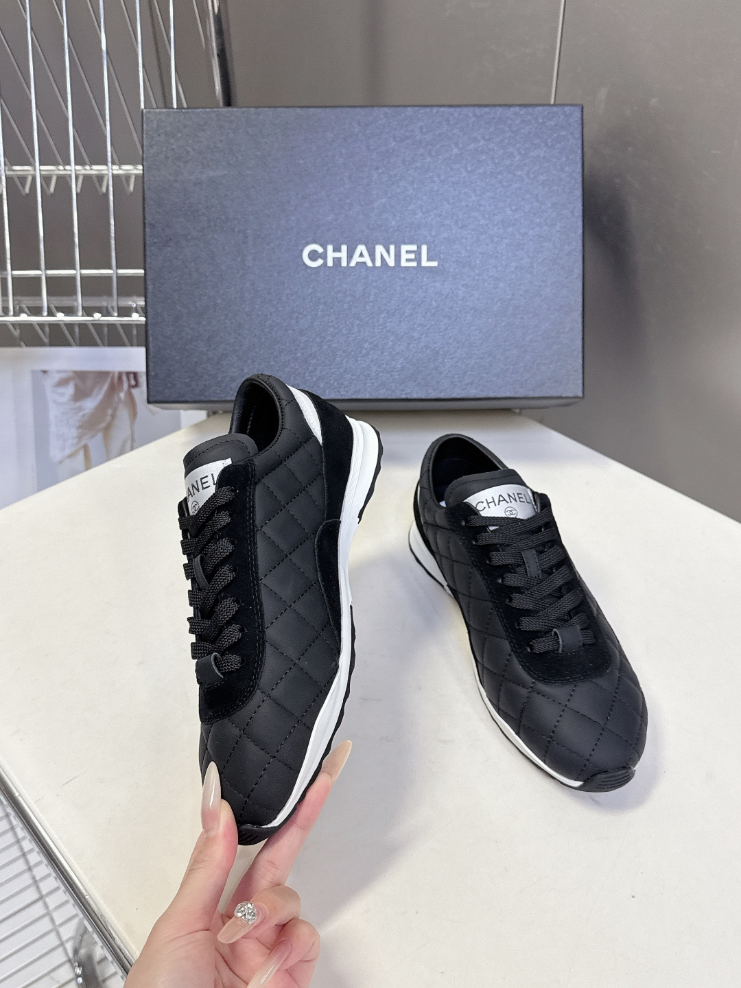 Pair of black Chanel quilted sneakers with white CC logo and original designer box - Hình 4