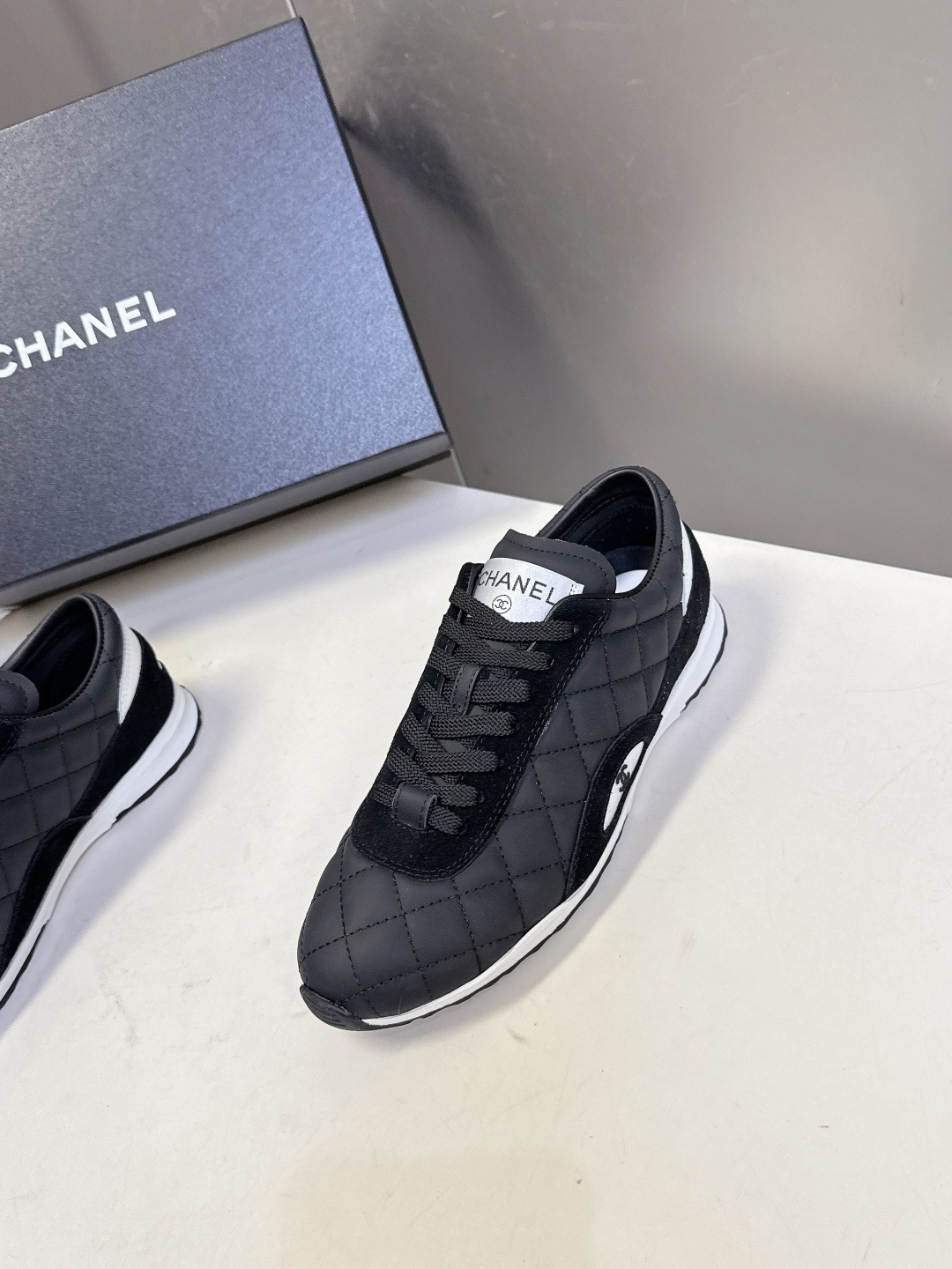 Pair of black Chanel quilted sneakers with white CC logo and original designer box - Hình 3