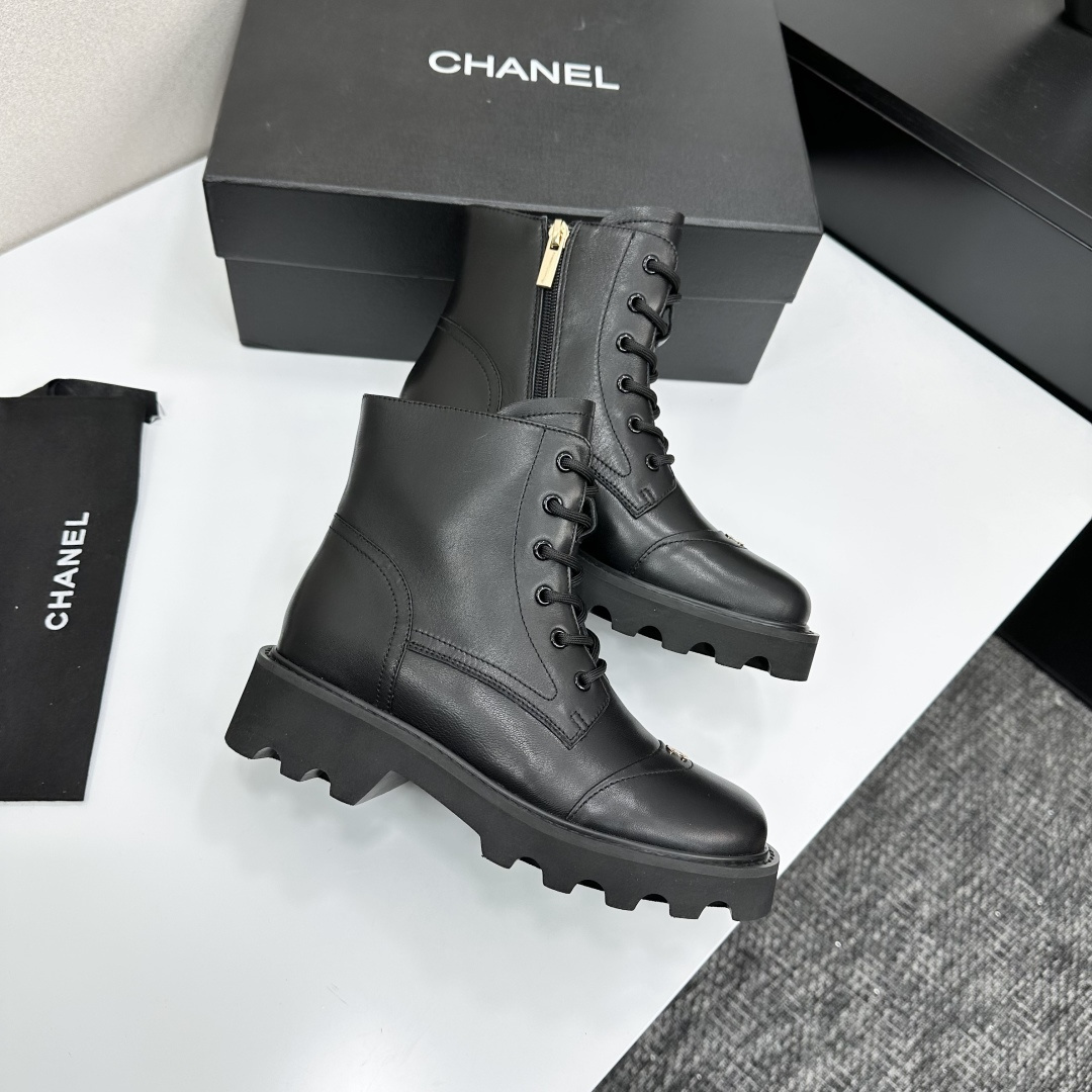 High-end black leather combat boots with lace-up front, side zipper, and chunky lug sole displayed on a black box. - Hình 8