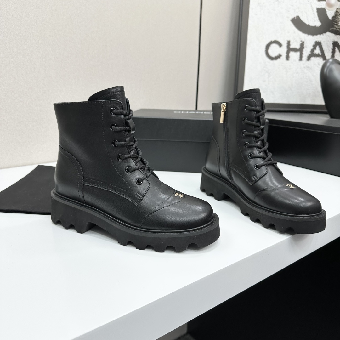 High-end black leather combat boots with lace-up front, side zipper, and chunky lug sole displayed on a black box. - Hình 6