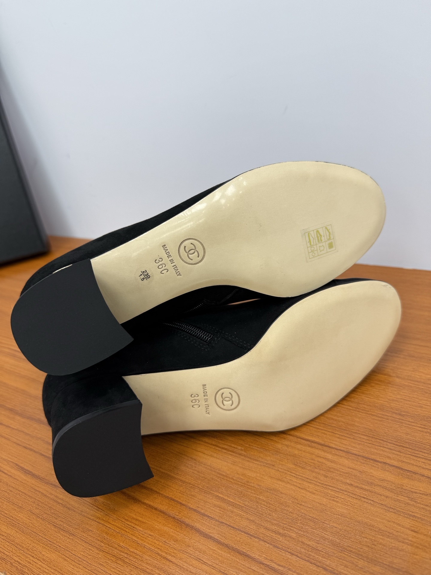 A pair of Chanel black suede ankle boots with ribbed cap toes and gold-tone CC logo on the block heels. - Hình 9