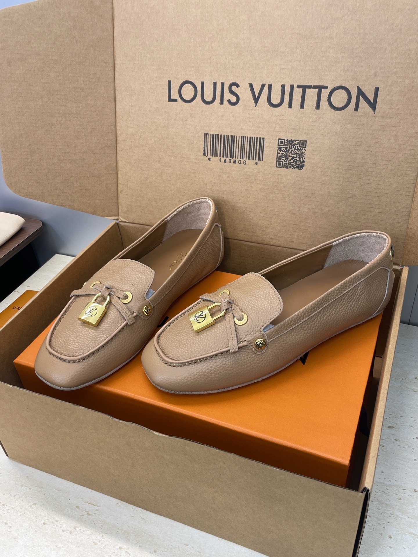 Louis Vuitton Beige Leather Loafers with Gold Padlock Detail
