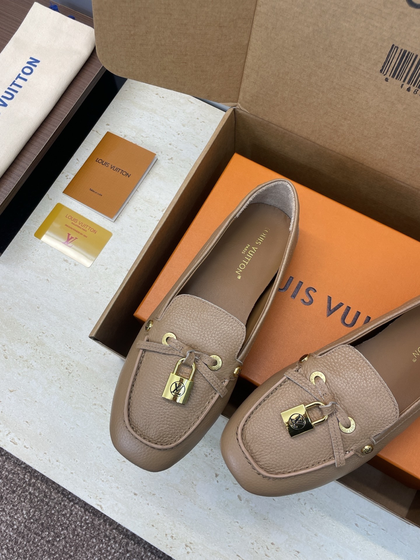 Louis Vuitton Beige Leather Loafers with Gold Padlock Detail