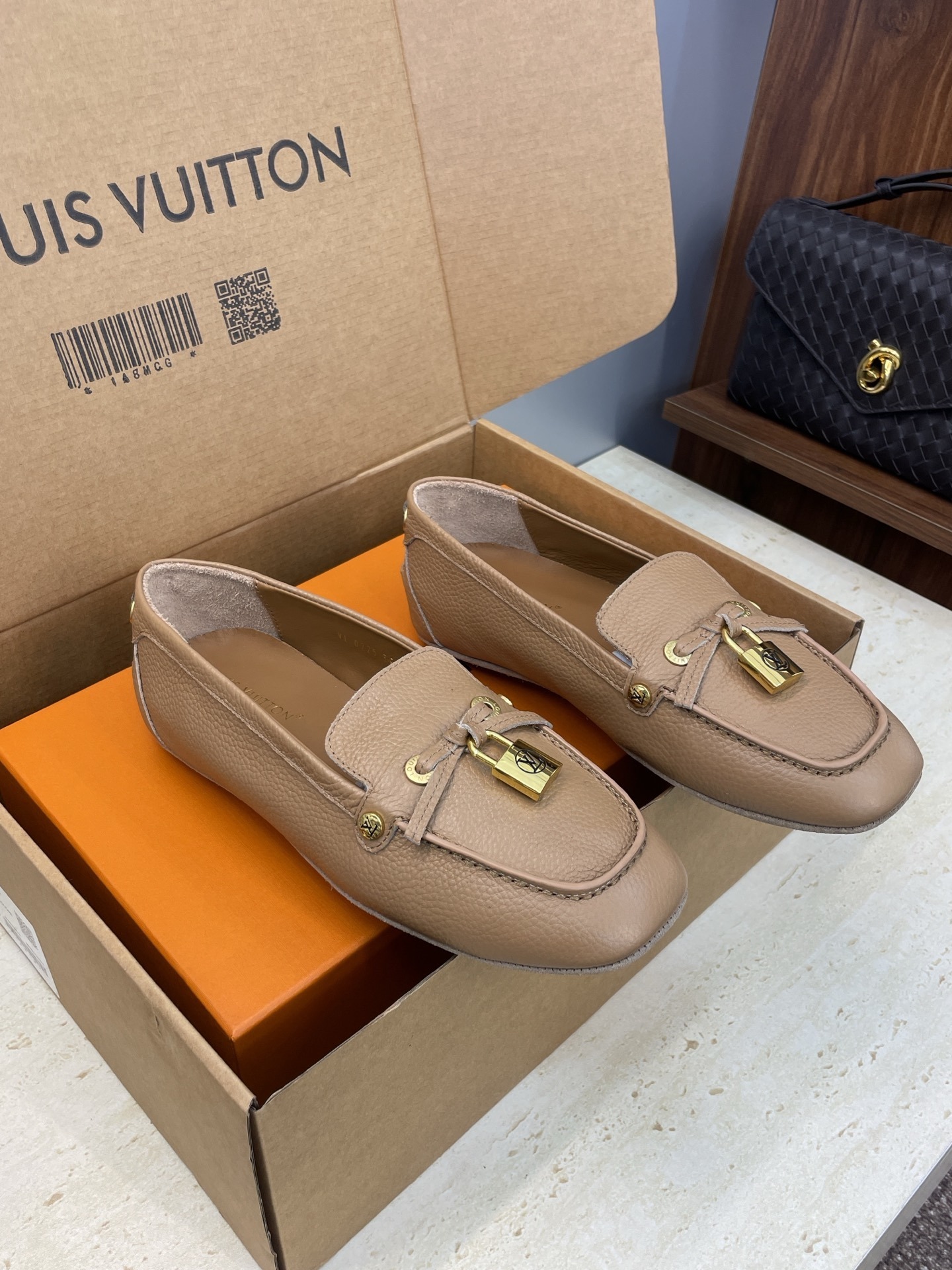 Louis Vuitton Beige Leather Loafers with Gold Padlock Detail