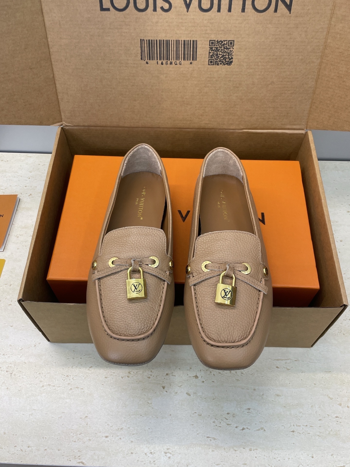 Louis Vuitton Beige Leather Loafers with Gold Padlock Detail