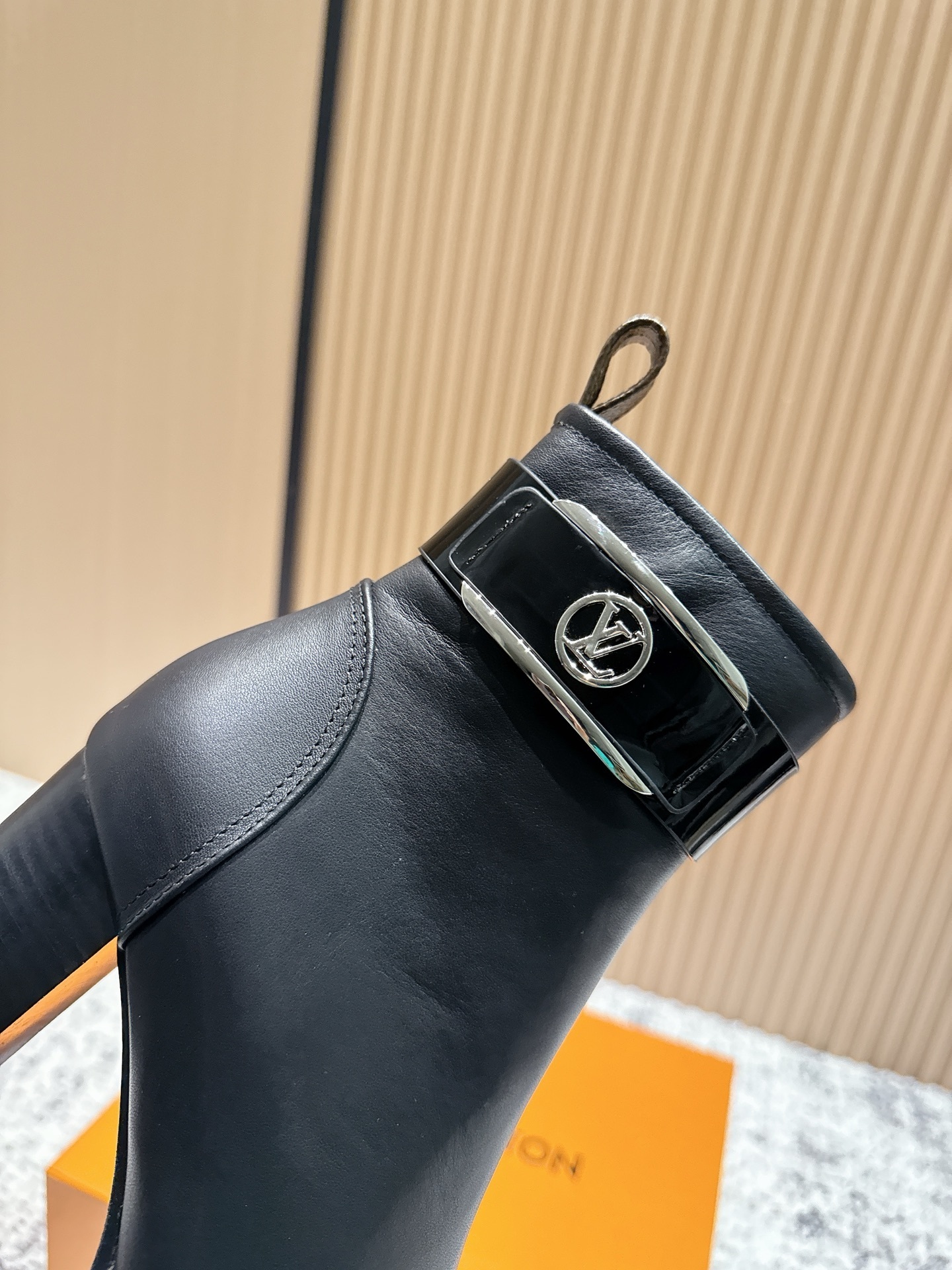 Luxury Black Leather Ankle Boots with Buckle and Monogram Tab