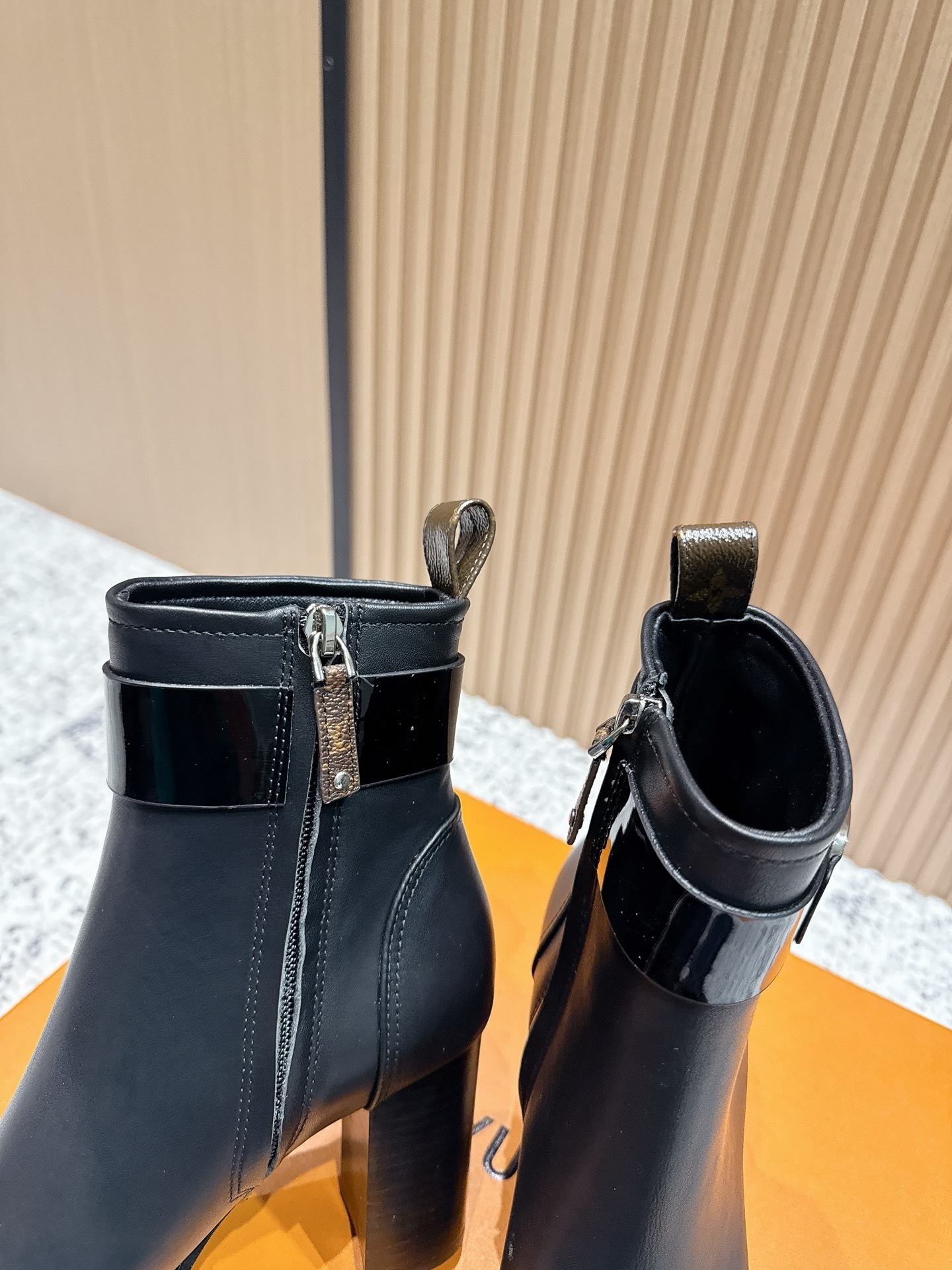 Luxury Black Leather Ankle Boots with Buckle and Monogram Tab