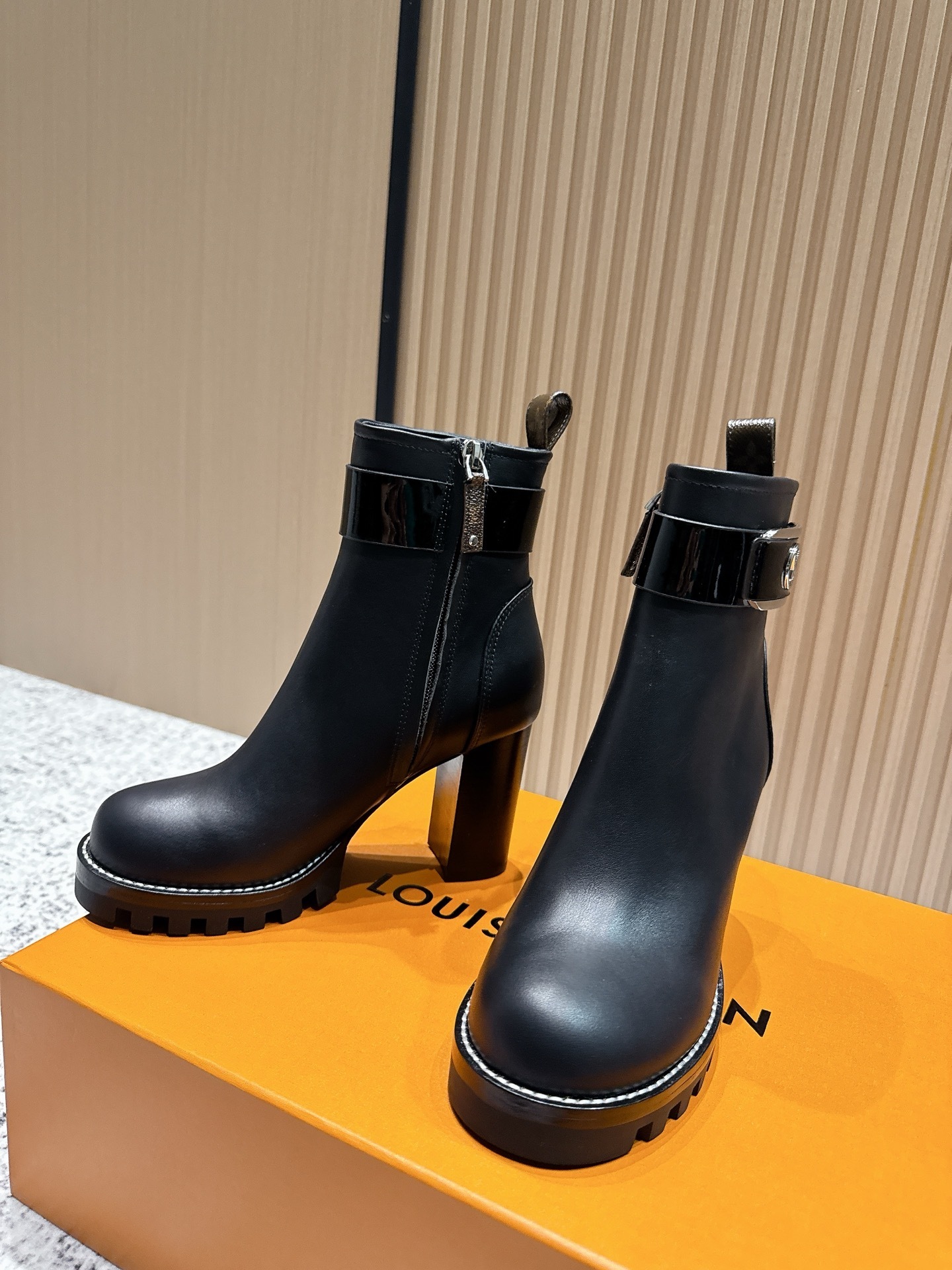 Luxury Black Leather Ankle Boots with Buckle and Monogram Tab