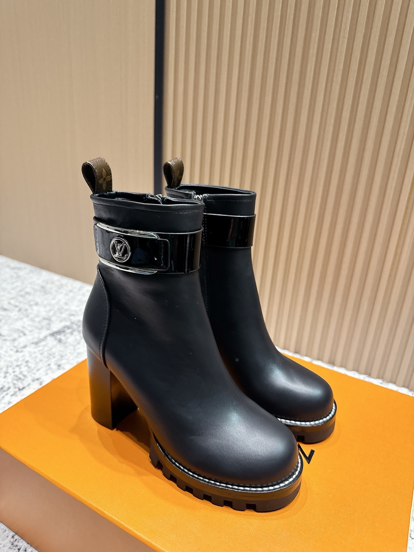 Luxury Black Leather Ankle Boots with Buckle and Monogram Tab