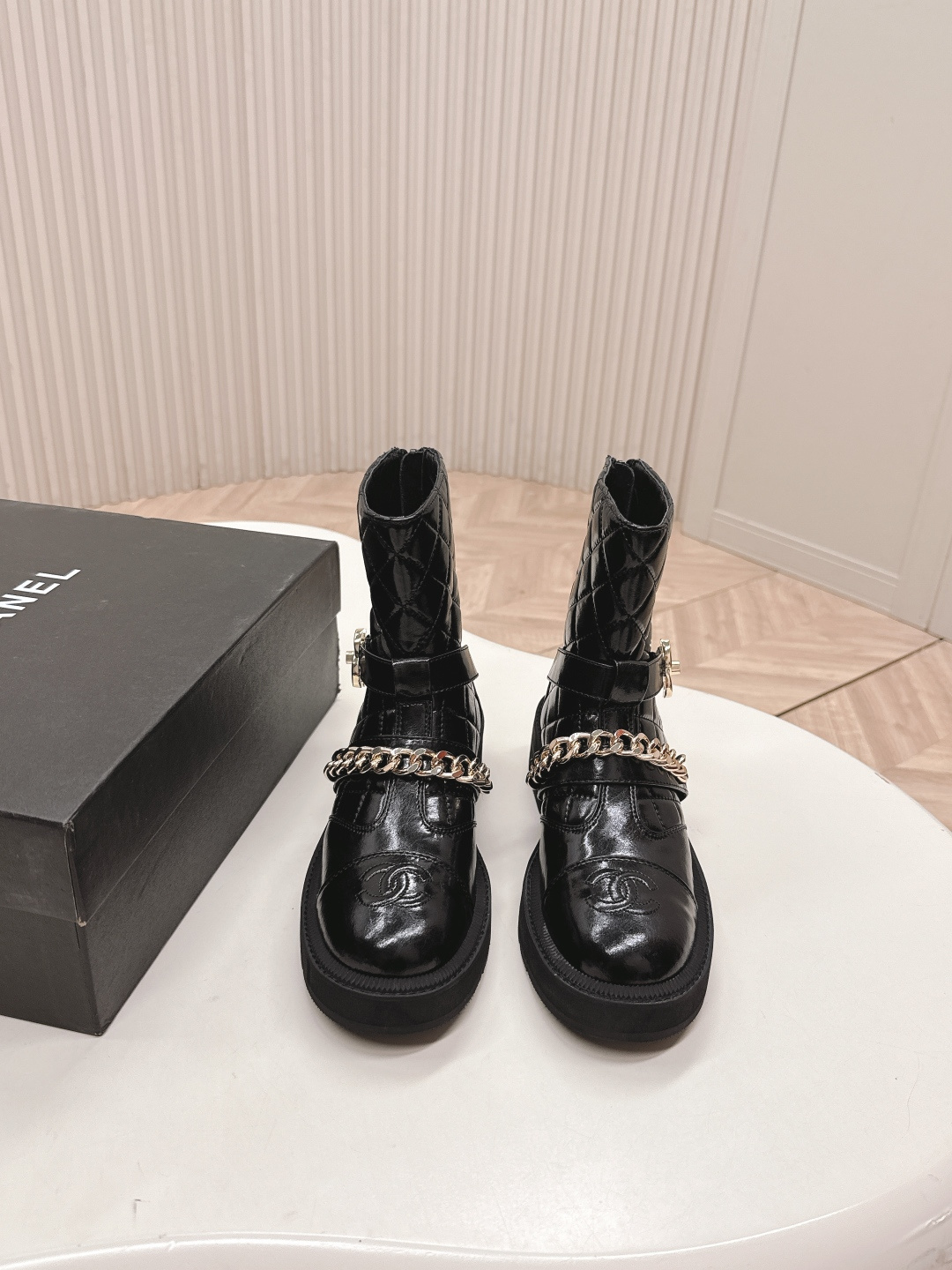 Luxury Black Quilted Leather Ankle Boots with Gold Chain Detail