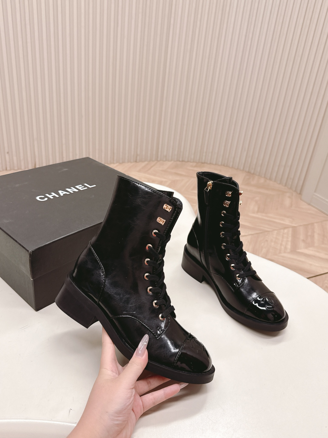 Pair of Chanel black patent leather lace-up ankle boots with embossed CC logo on toe cap and gold-tone hardware. - Hình 6