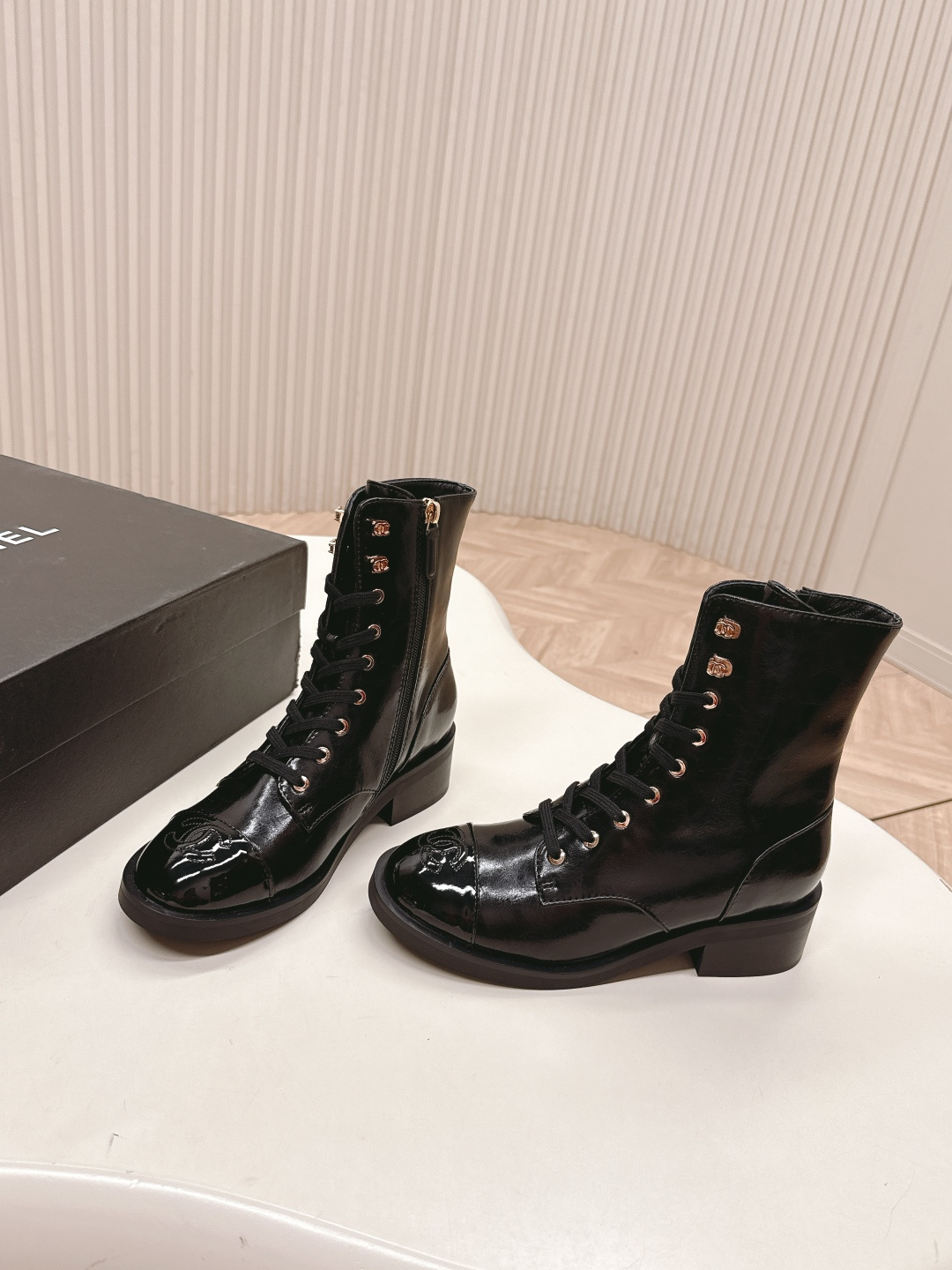 Pair of Chanel black patent leather lace-up ankle boots with embossed CC logo on toe cap and gold-tone hardware. - Hình 2