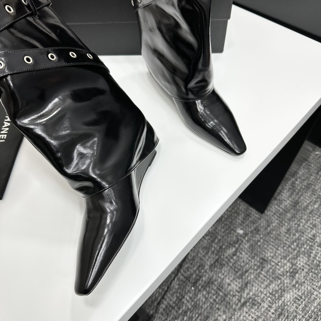 High-fashion black patent leather pointed-toe wedge boots featuring multiple silver buckle straps and a slouchy fold-over shaft design. - Hình 8