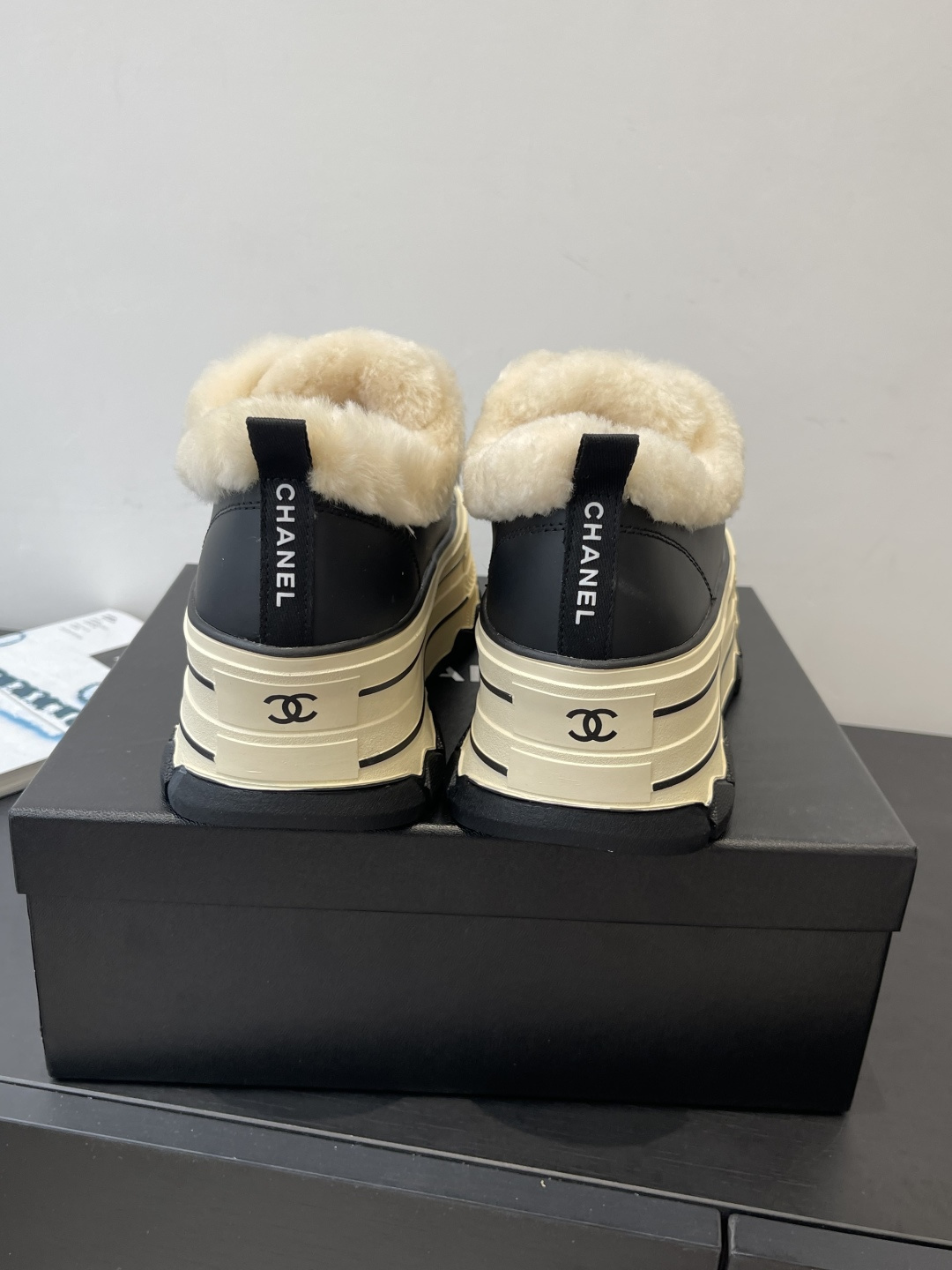 Pair of black Chanel platform sneakers with cream shearling lining and CC logo on the toe cap. - Hình 8