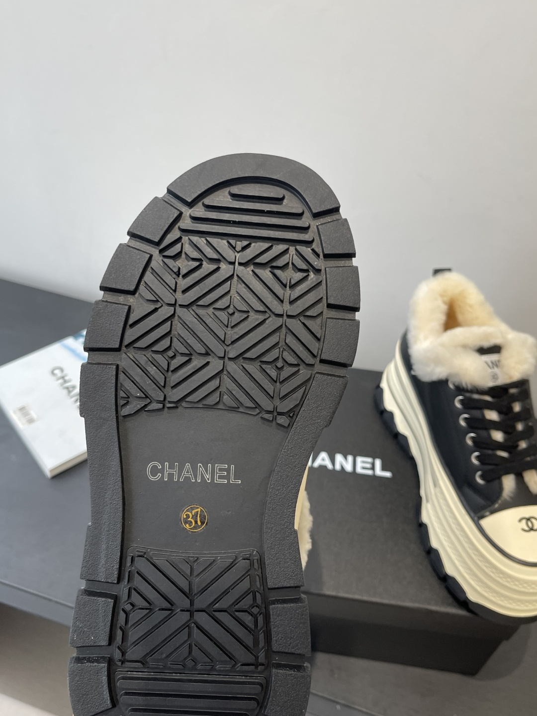 Pair of black Chanel platform sneakers with cream shearling lining and CC logo on the toe cap. - Hình 5