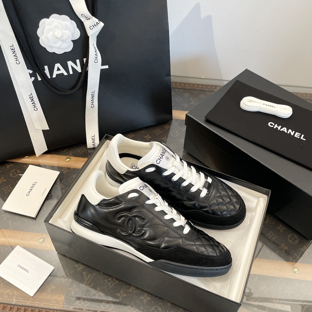 Luxury black Chanel sneakers with white quilted leather and CC logo detailing - Hình 7