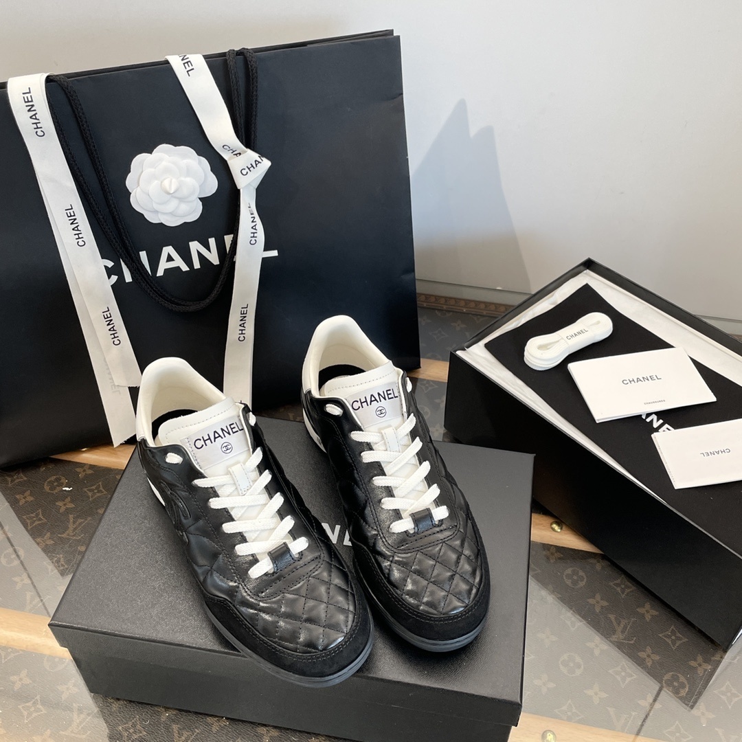 Luxury black Chanel sneakers with white quilted leather and CC logo detailing - Hình 2