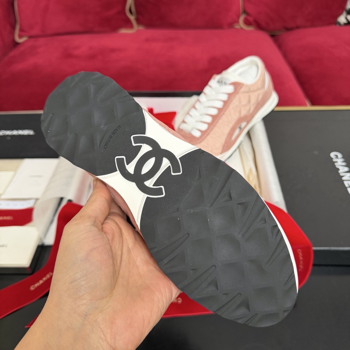 Authentic pink quilted Chanel sneakers with white laces and interlocking CC logo in original packaging with red ribbon. - Hình 9