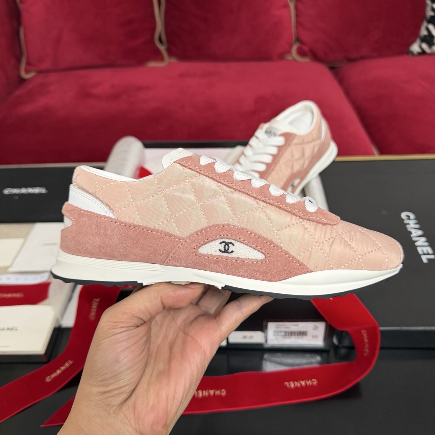 Authentic pink quilted Chanel sneakers with white laces and interlocking CC logo in original packaging with red ribbon. - Hình 5