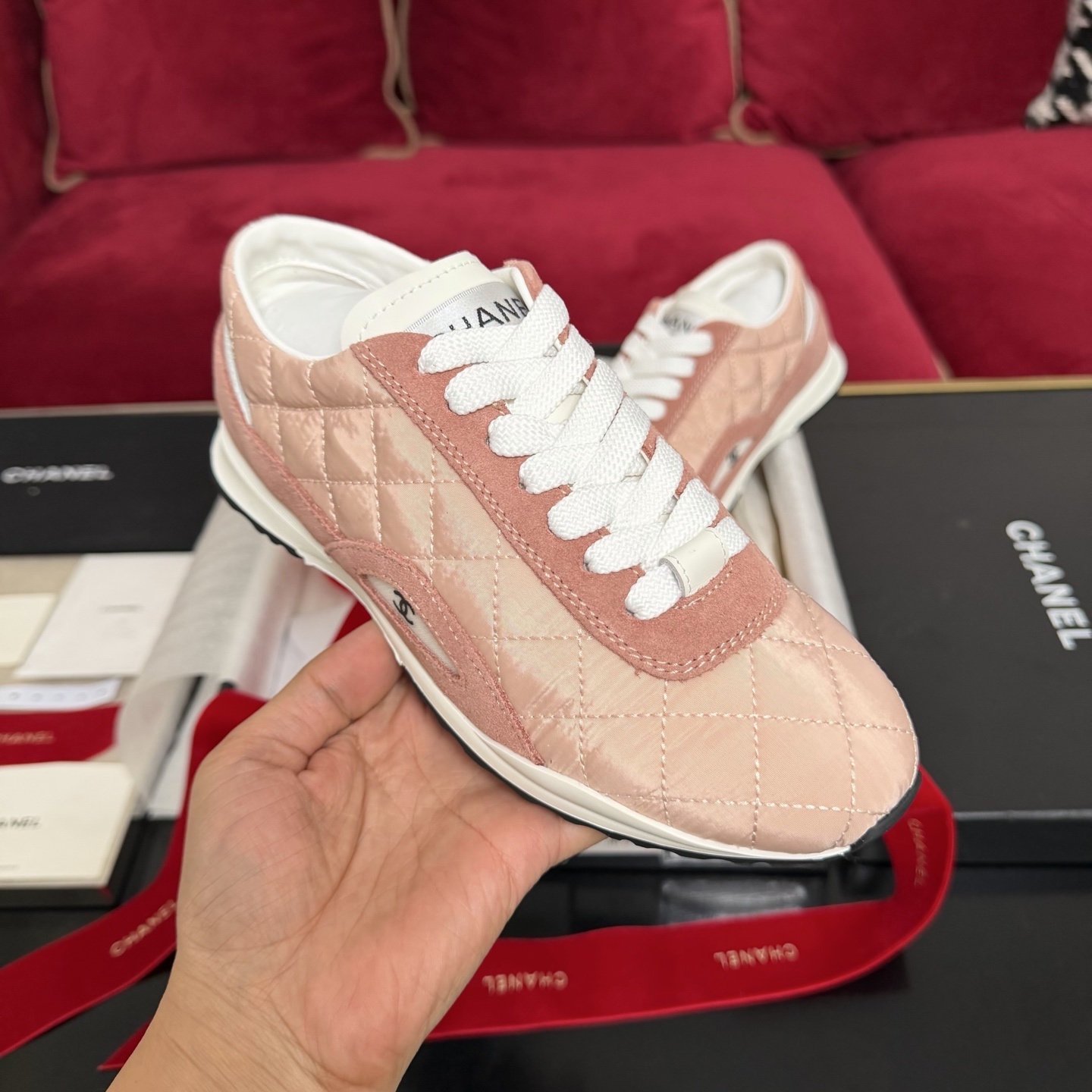 Authentic pink quilted Chanel sneakers with white laces and interlocking CC logo in original packaging with red ribbon. - Hình 4