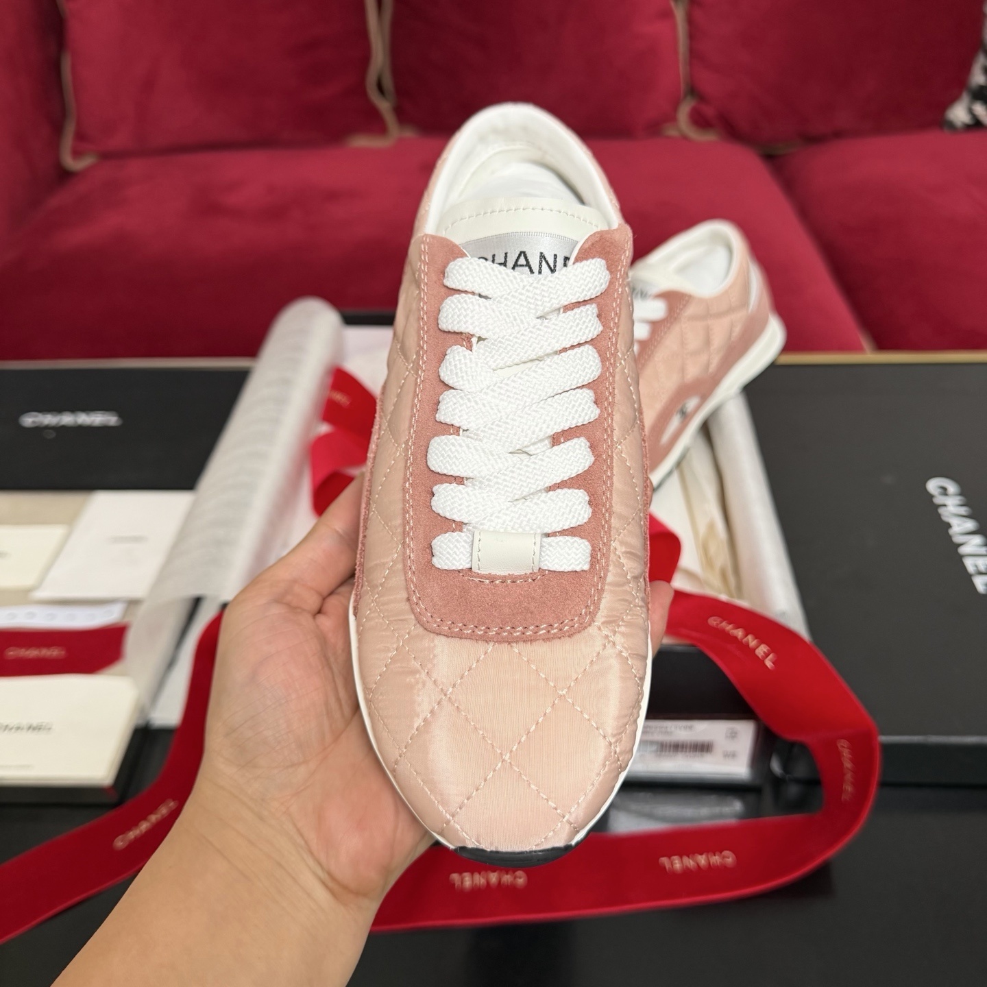 Authentic pink quilted Chanel sneakers with white laces and interlocking CC logo in original packaging with red ribbon. - Hình 3