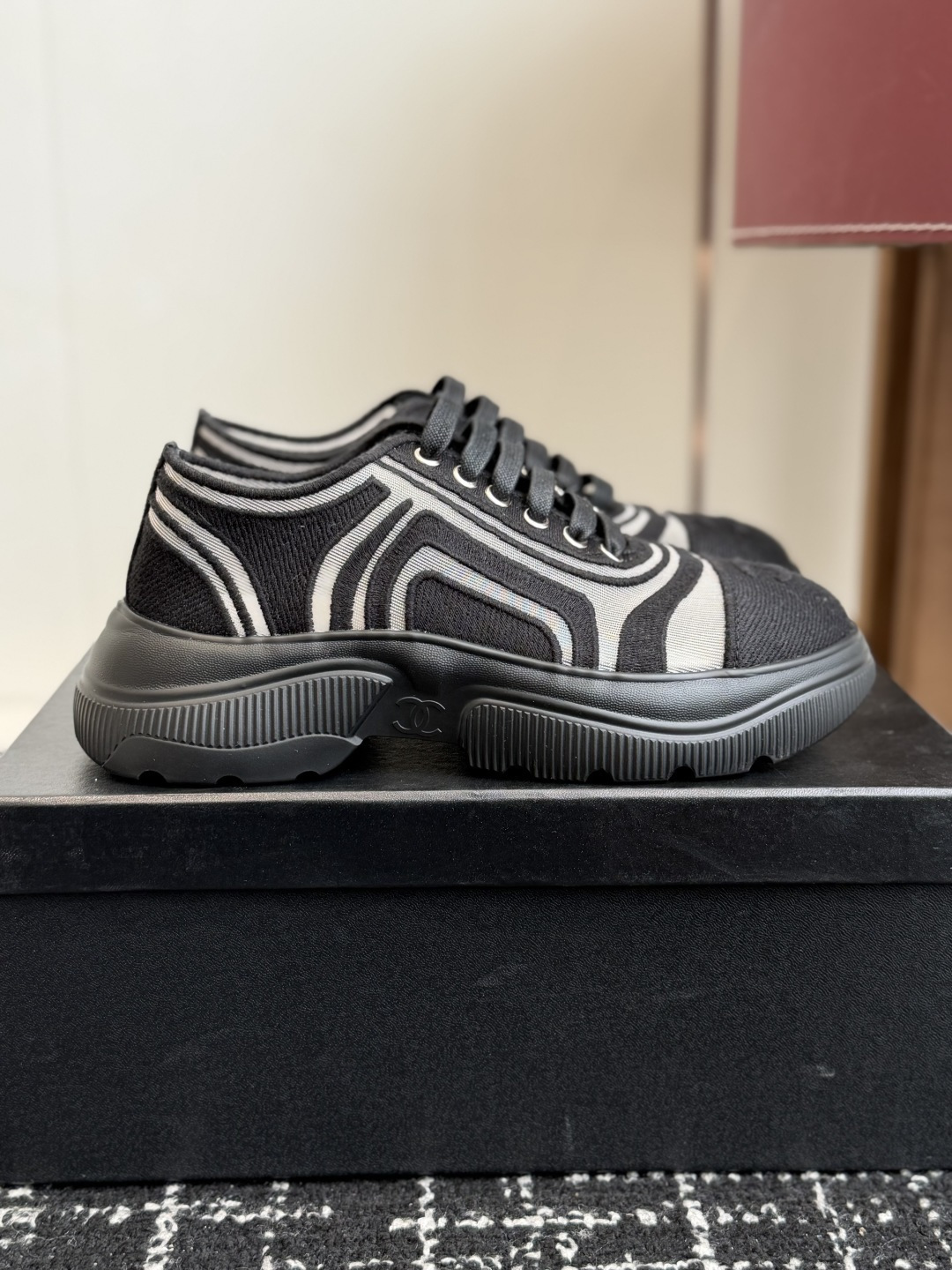 Pair of Chanel black and white mesh sneakers with chunky soles and interlocking CC logo on the toe cap. - Hình 2