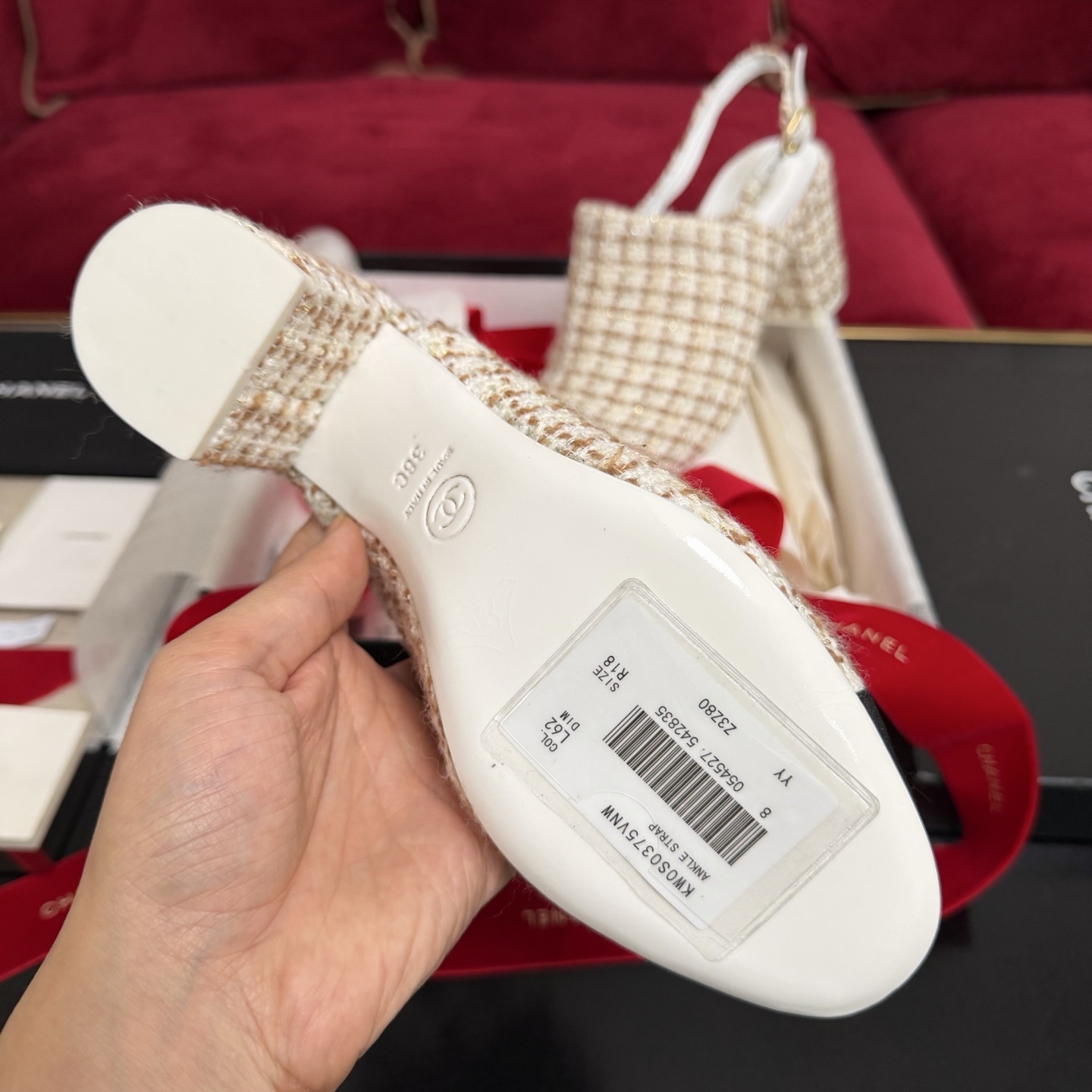 Luxury Chanel tweed slingback pumps with black cap toe and CC logo shown in original packaging with red ribbons. - Hình 9
