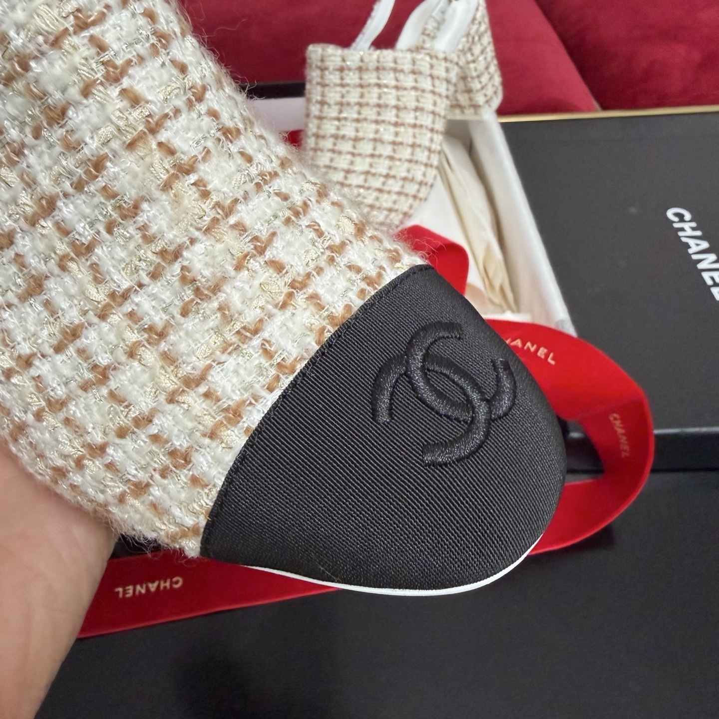 Luxury Chanel tweed slingback pumps with black cap toe and CC logo shown in original packaging with red ribbons. - Hình 6