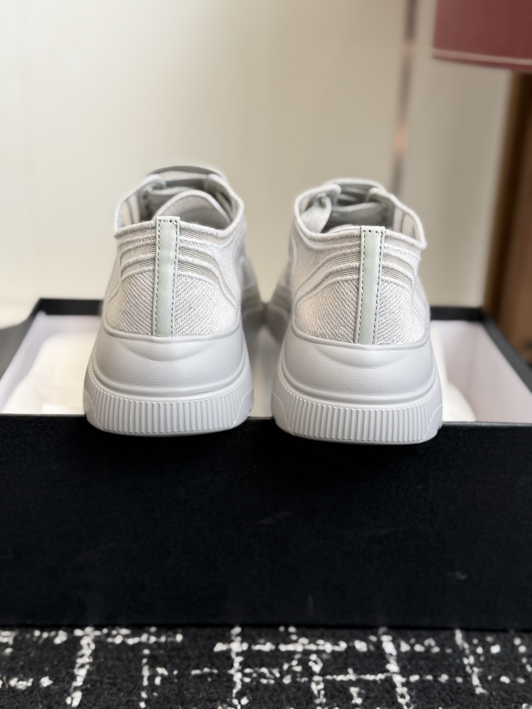 A pair of white Chanel mesh platform sneakers with the iconic interlocking CC logo on the toe cap. - Hình 8