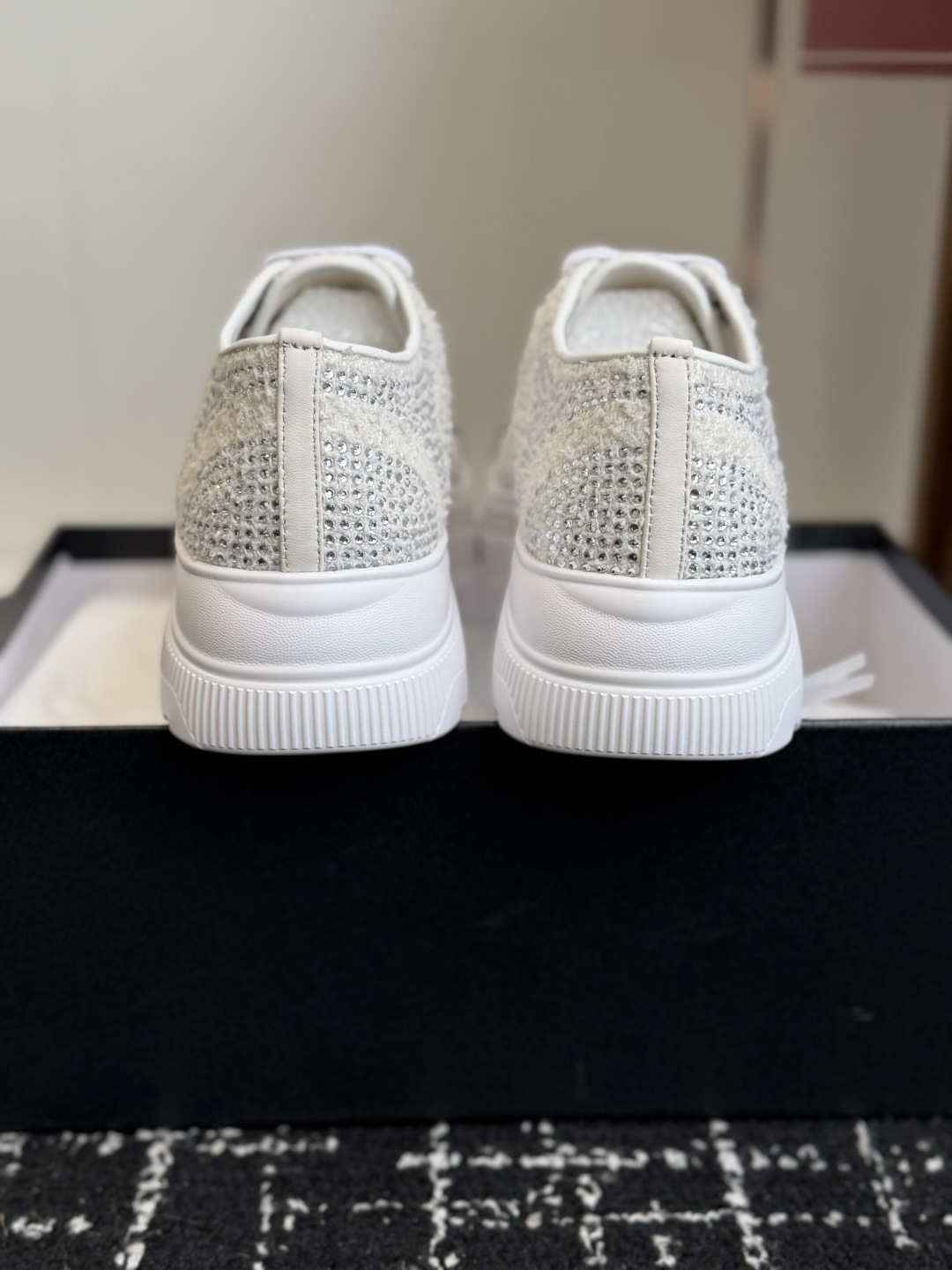 Luxury Chanel white tweed sneakers with shimmering crystal embellishments and black crystal toe caps featuring the CC logo - Hình 8