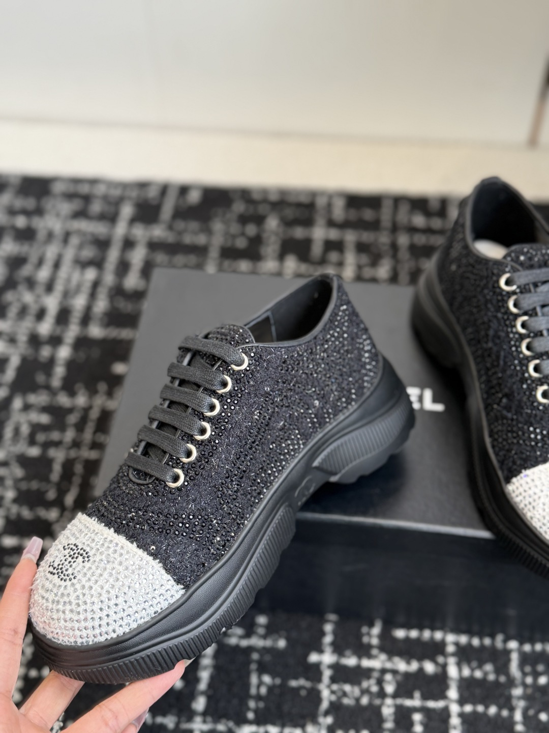Pair of Chanel black and white sneakers covered in sparkling crystals with CC logo on the toe cap. - Hình 6