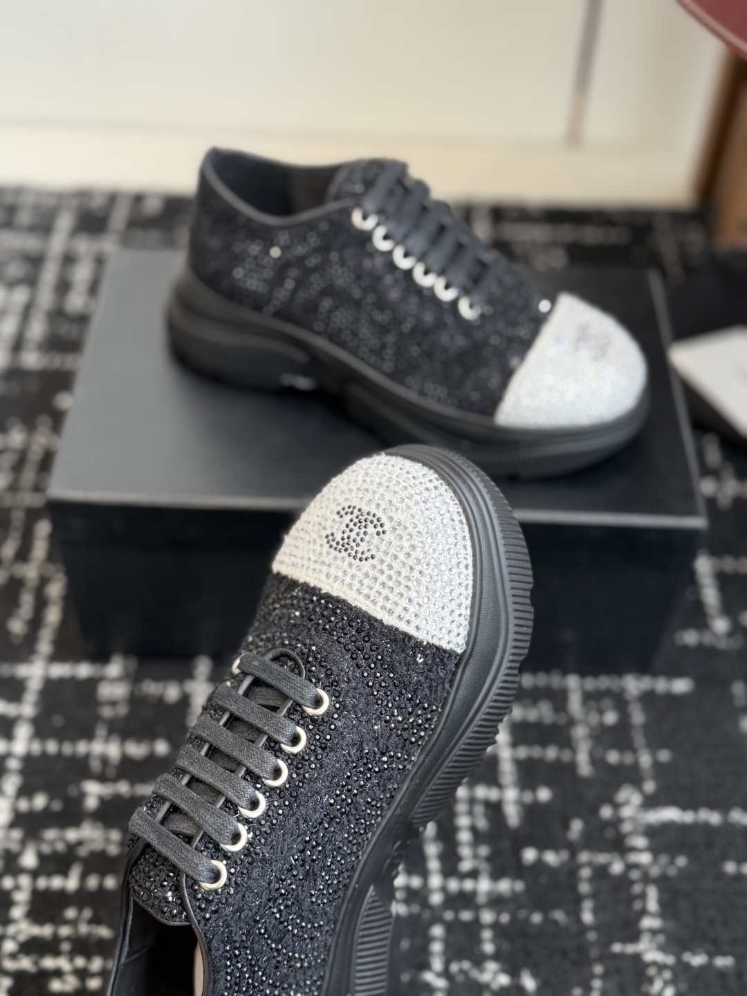 Pair of Chanel black and white sneakers covered in sparkling crystals with CC logo on the toe cap. - Hình 5