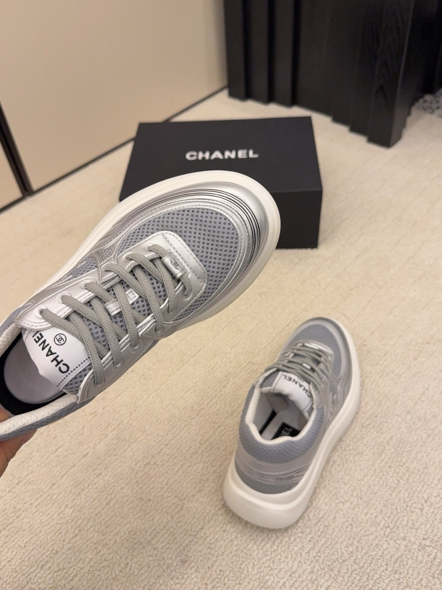 Two pairs of Chanel luxury mesh sneakers in beige and silver with chunky white soles and signature CC logo. - Hình 8