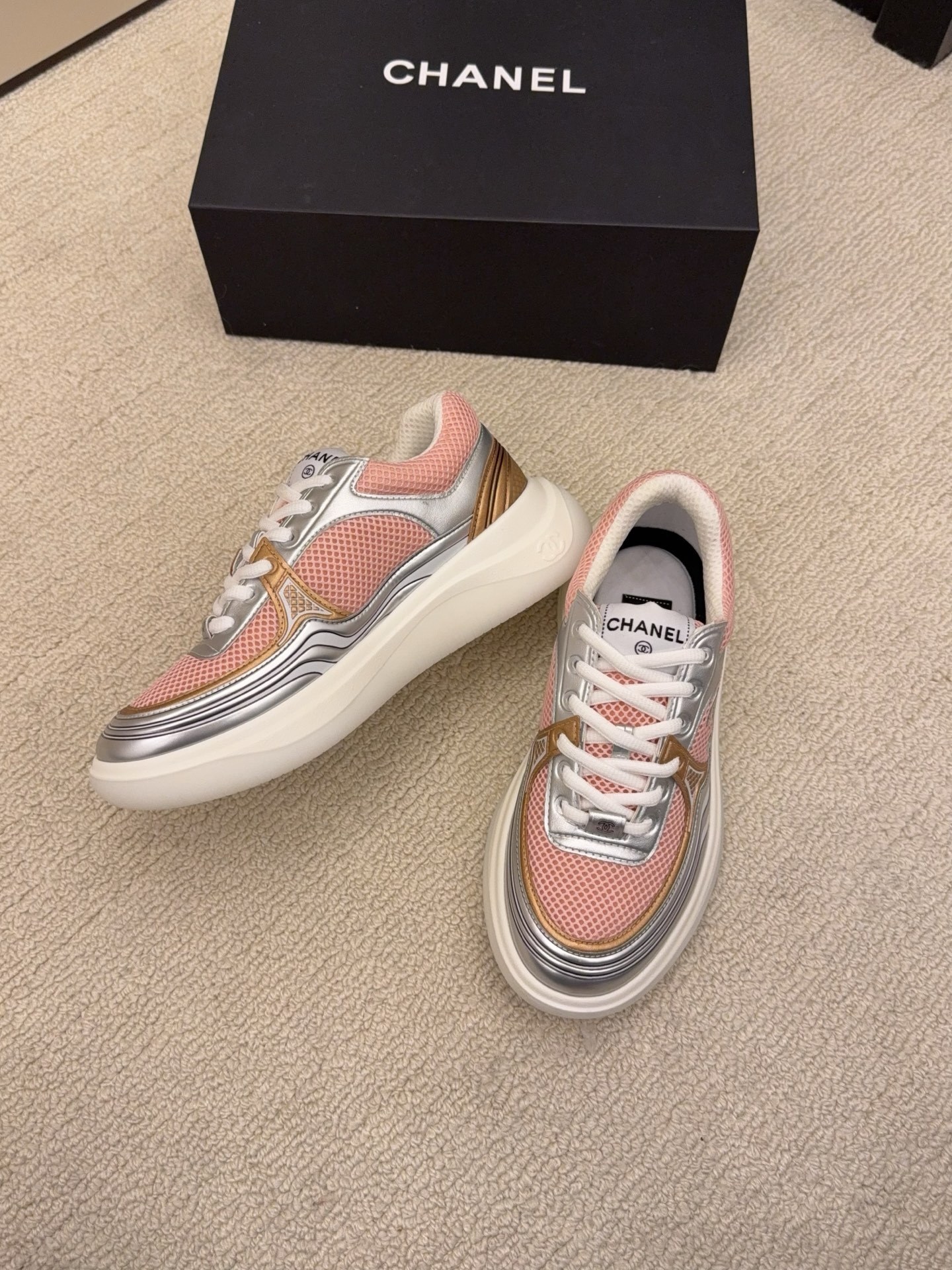 Pair of Chanel luxury sneakers in mint green and peach with metallic silver accents and mesh panels on a white platform sole. - Hình 7