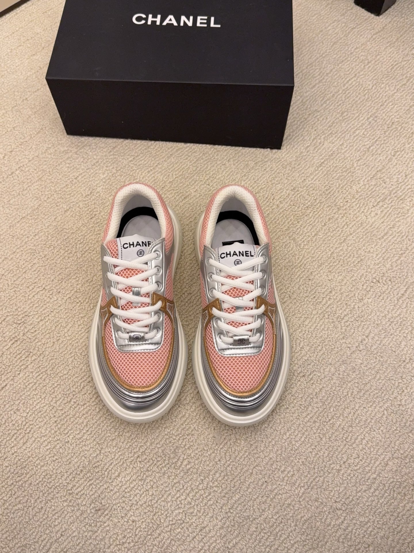 Pair of Chanel luxury sneakers in mint green and peach with metallic silver accents and mesh panels on a white platform sole. - Hình 6