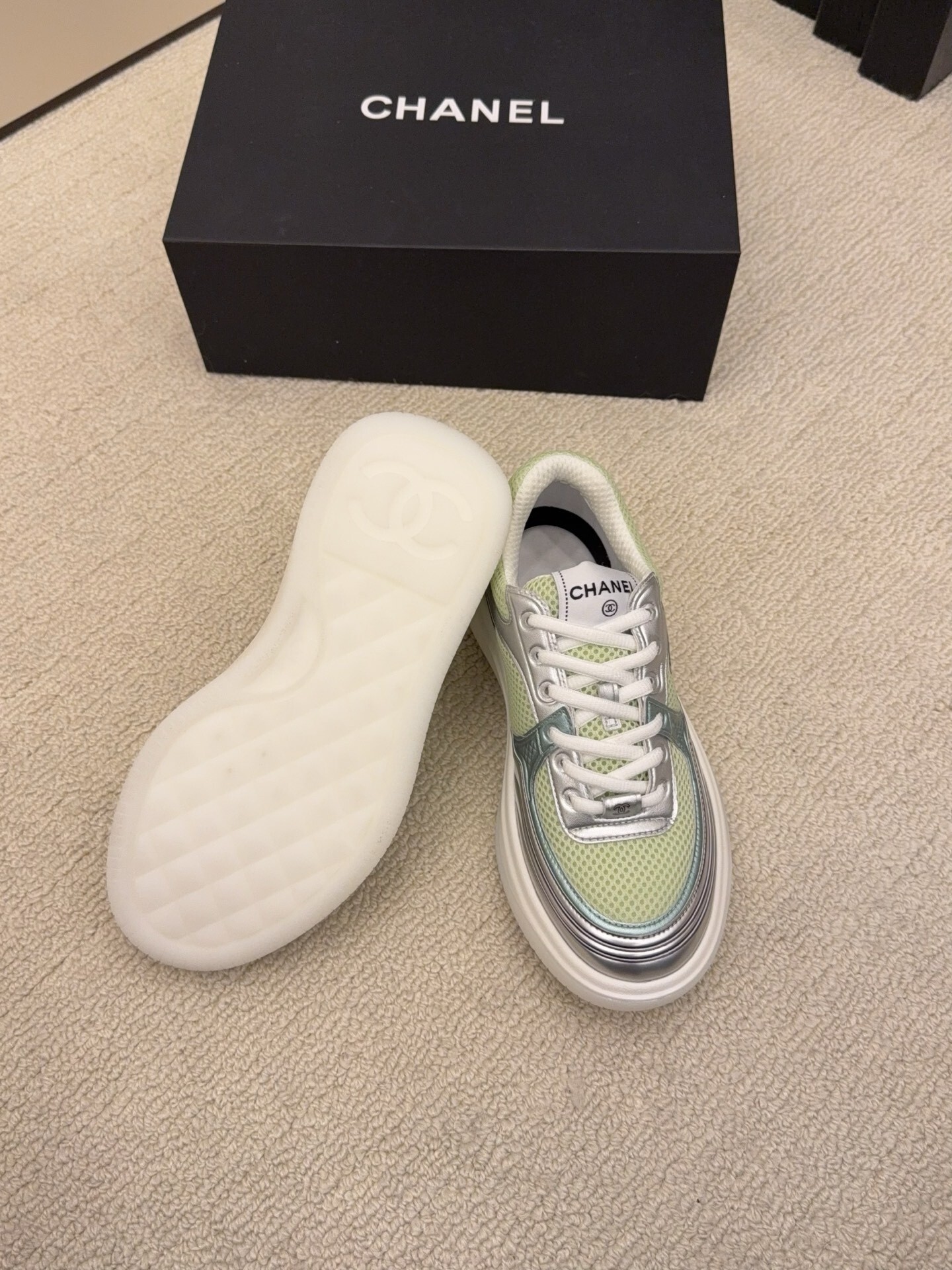 Pair of Chanel luxury sneakers in mint green and peach with metallic silver accents and mesh panels on a white platform sole. - Hình 5