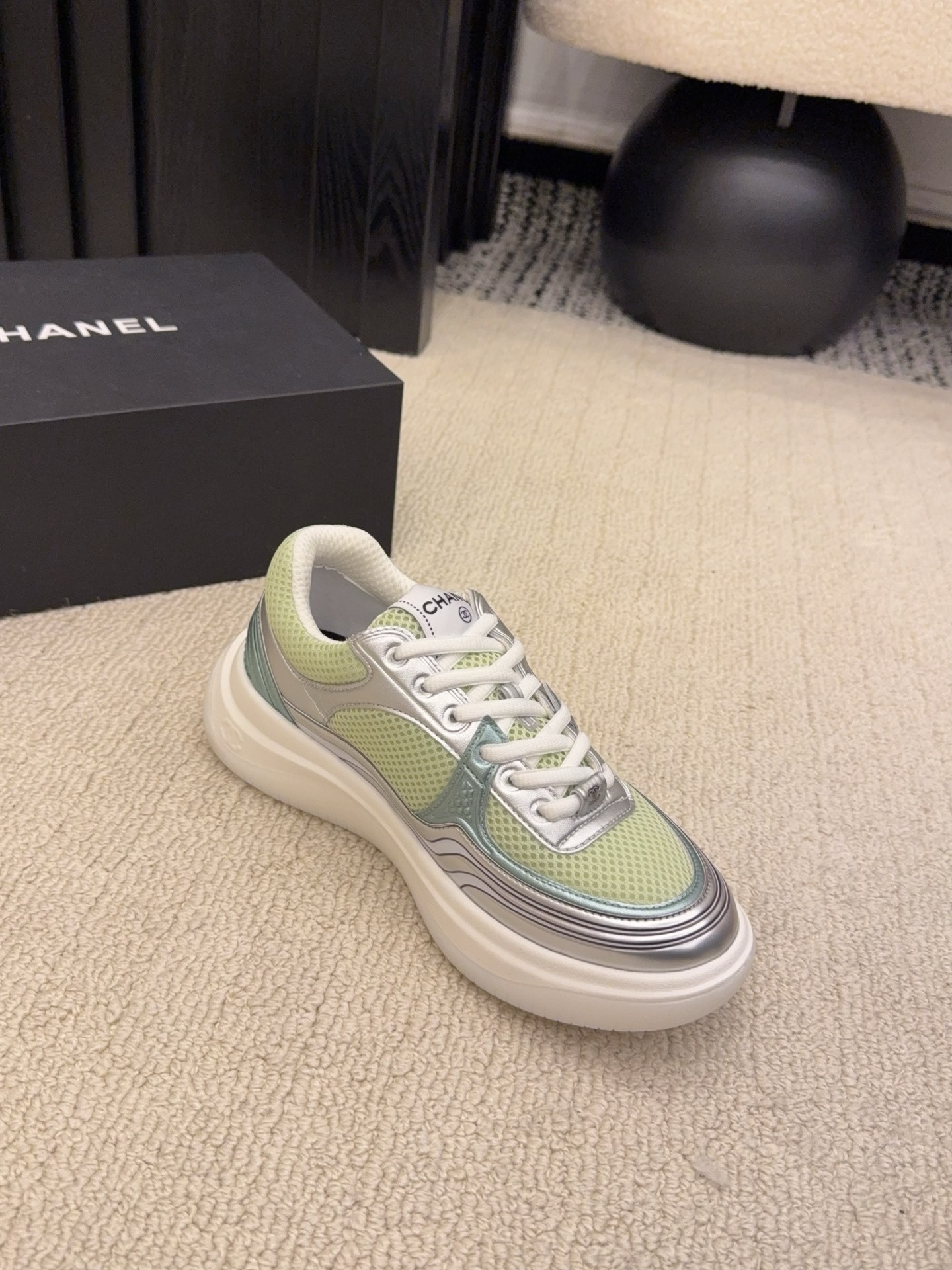 Pair of Chanel luxury sneakers in mint green and peach with metallic silver accents and mesh panels on a white platform sole. - Hình 4