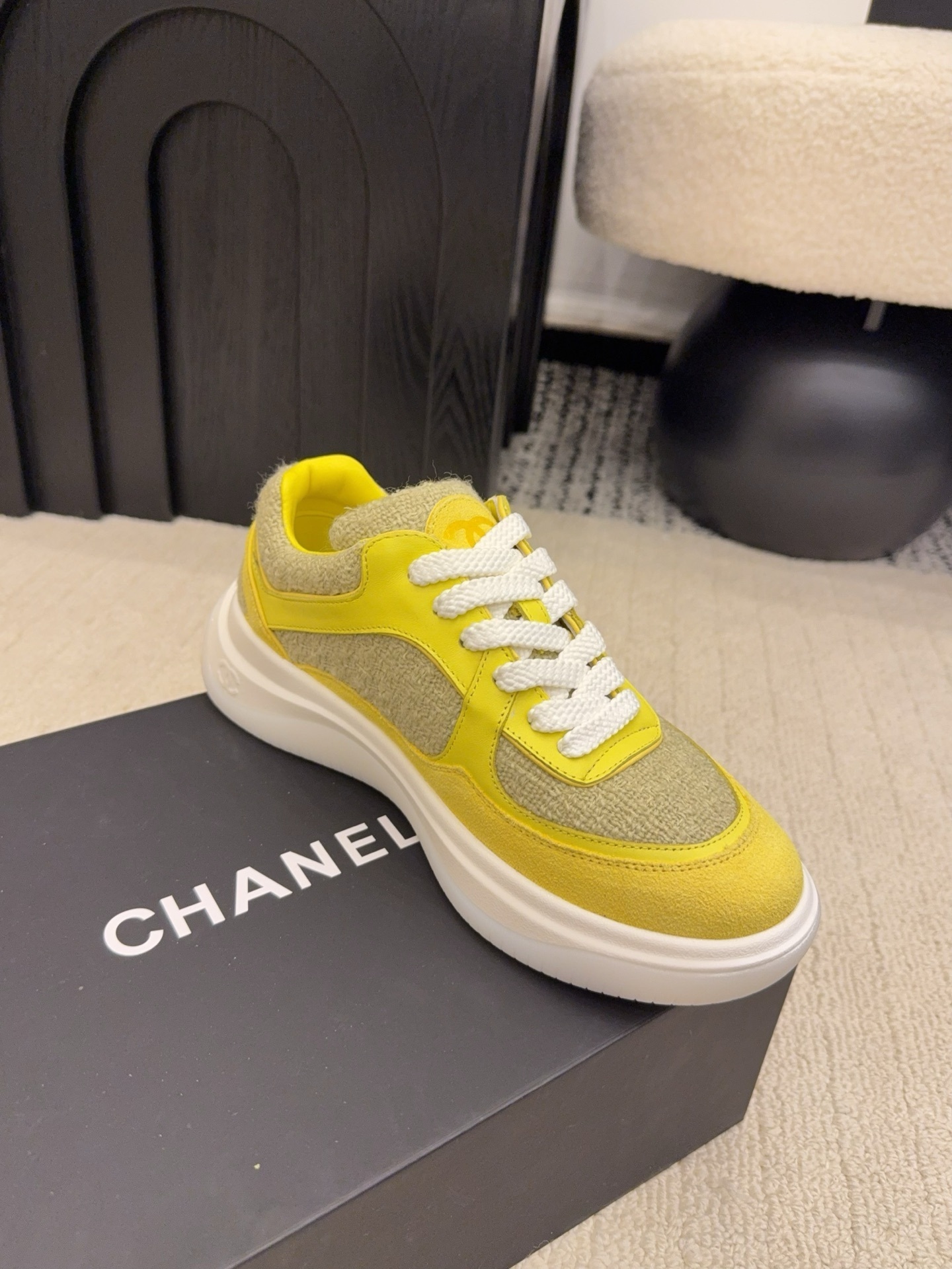 Pair of luxury yellow tweed and suede sneakers with white chunky soles and CC logo on a black box - Hình 6